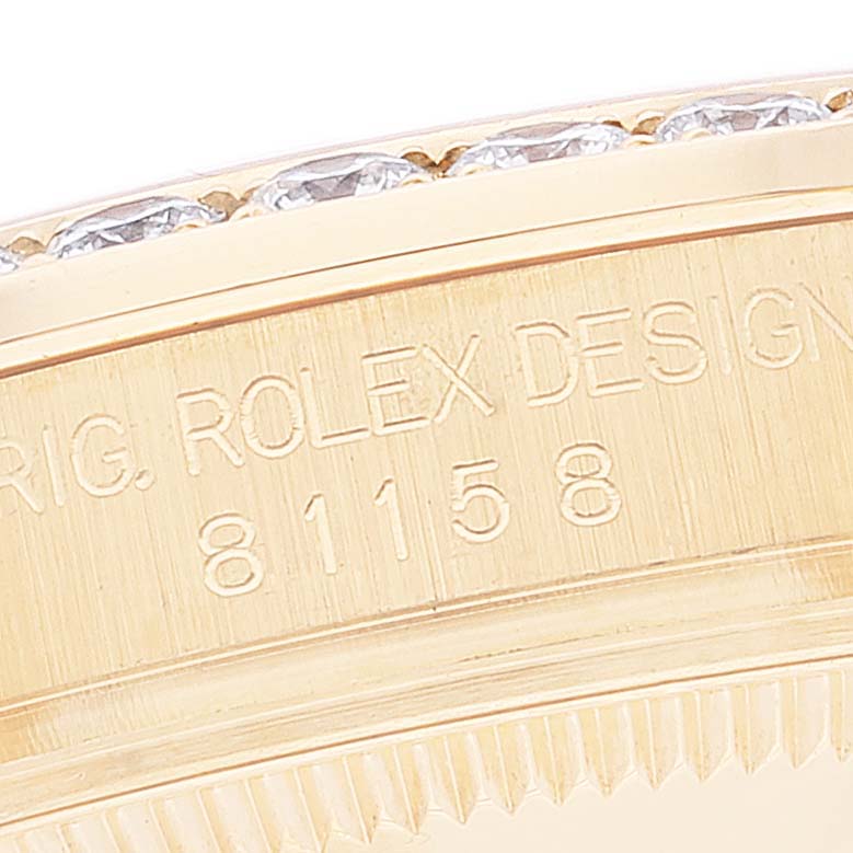 This close-up image shows the engraved bezel and diamond-studded edge of the Rolex Pearlmaster 81158 Women's Yellow Gold Mother of Pearl Dial 81158 Women's Yellow Gold Mother of Pearl Dial watch model.