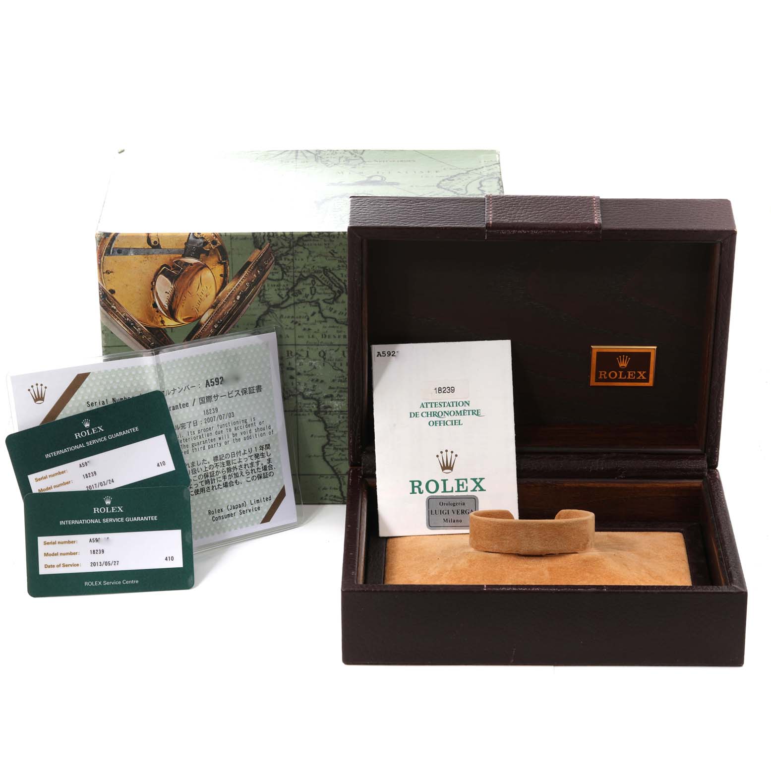 The image shows the accessories and packaging for a Rolex President 18239 Men's White Gold Silver Dial 18239 Men's White Gold Silver Dial model, including manuals, warranty cards, and a presentation box.