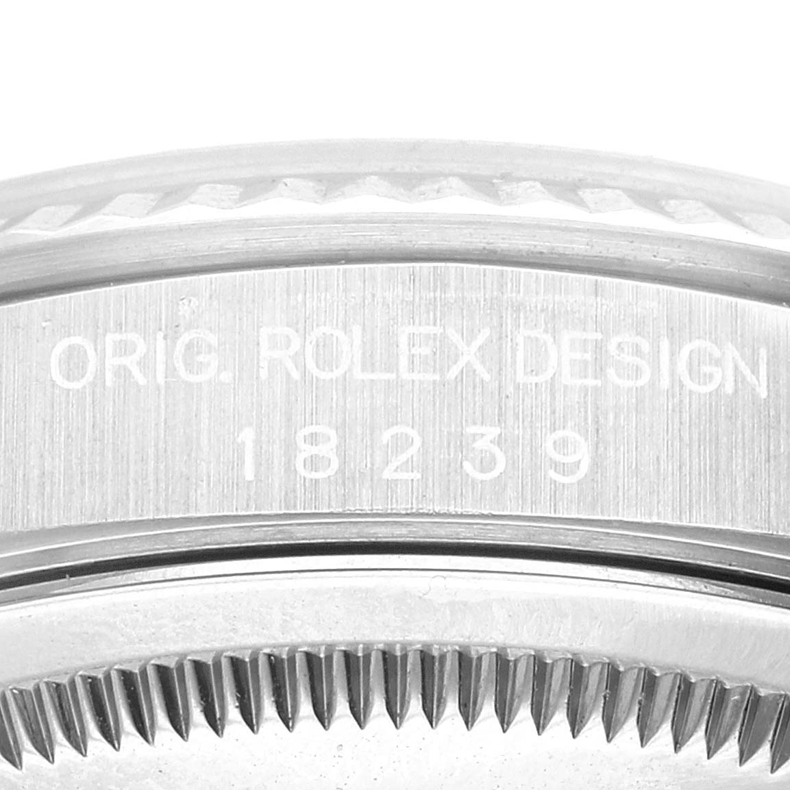 This image shows a close-up of the serial number and design engraving on a Rolex President 18239 Men's White Gold Silver Dial 18239 Men's White Gold Silver Dial model watch case.
