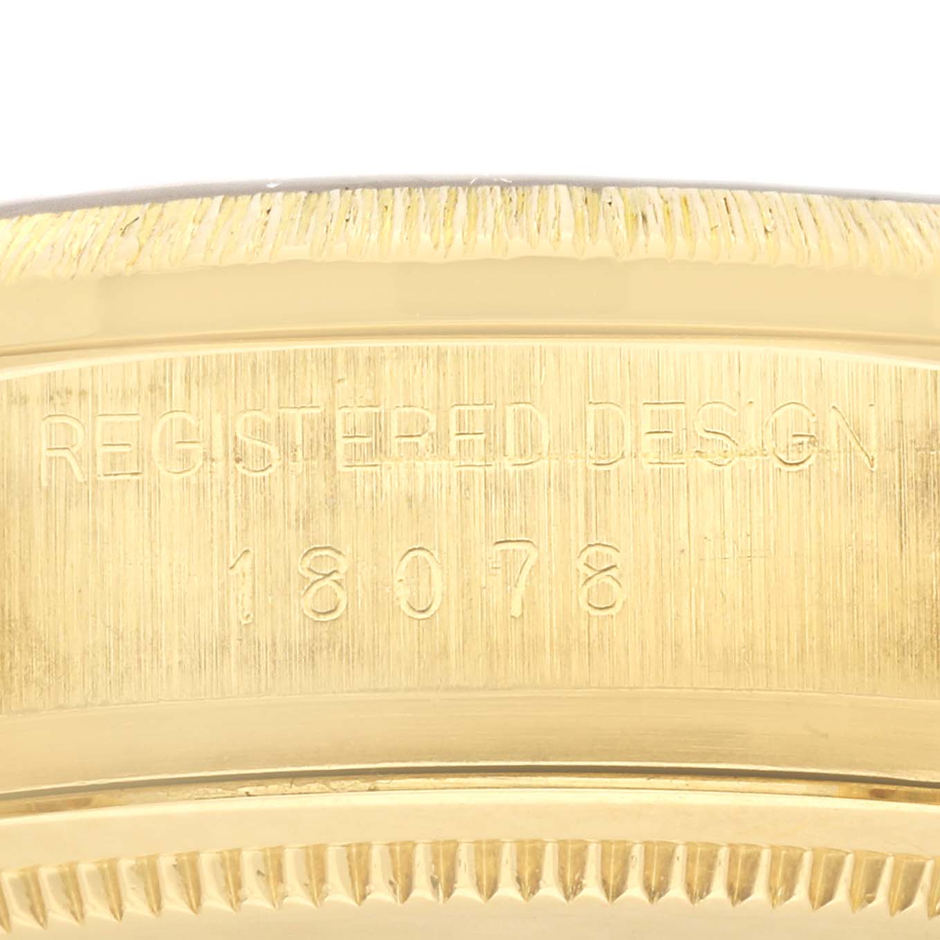 This close-up image shows the side of the President model Rolex watch, featuring the "REGISTERED DESIGN" and model number 18078.