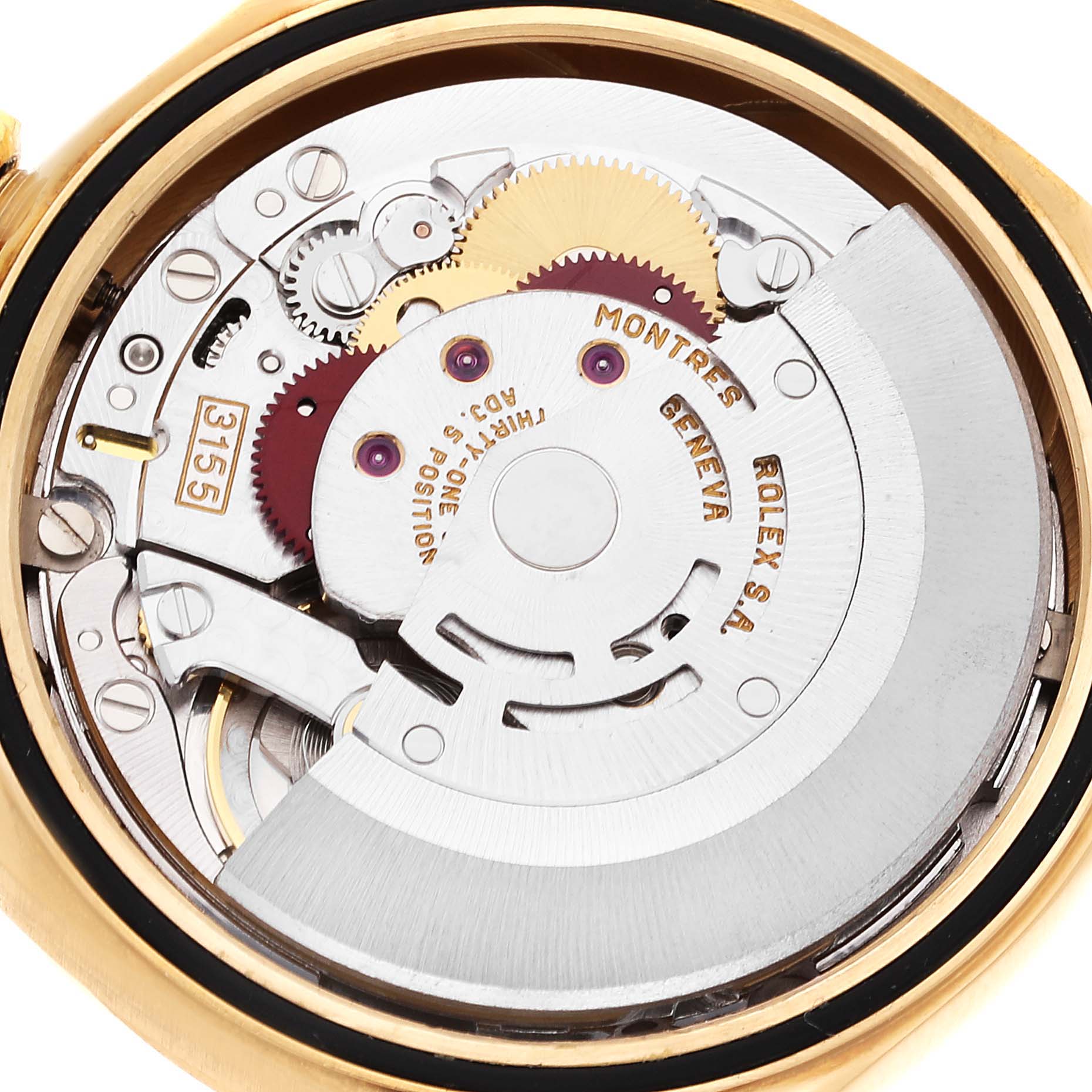 This image shows the inner mechanical movement of a Rolex President 18238 Men's Yellow Gold Champagne Dial 18238 Men's Yellow Gold Champagne Dial model watch, highlighting gears and other intricate parts.