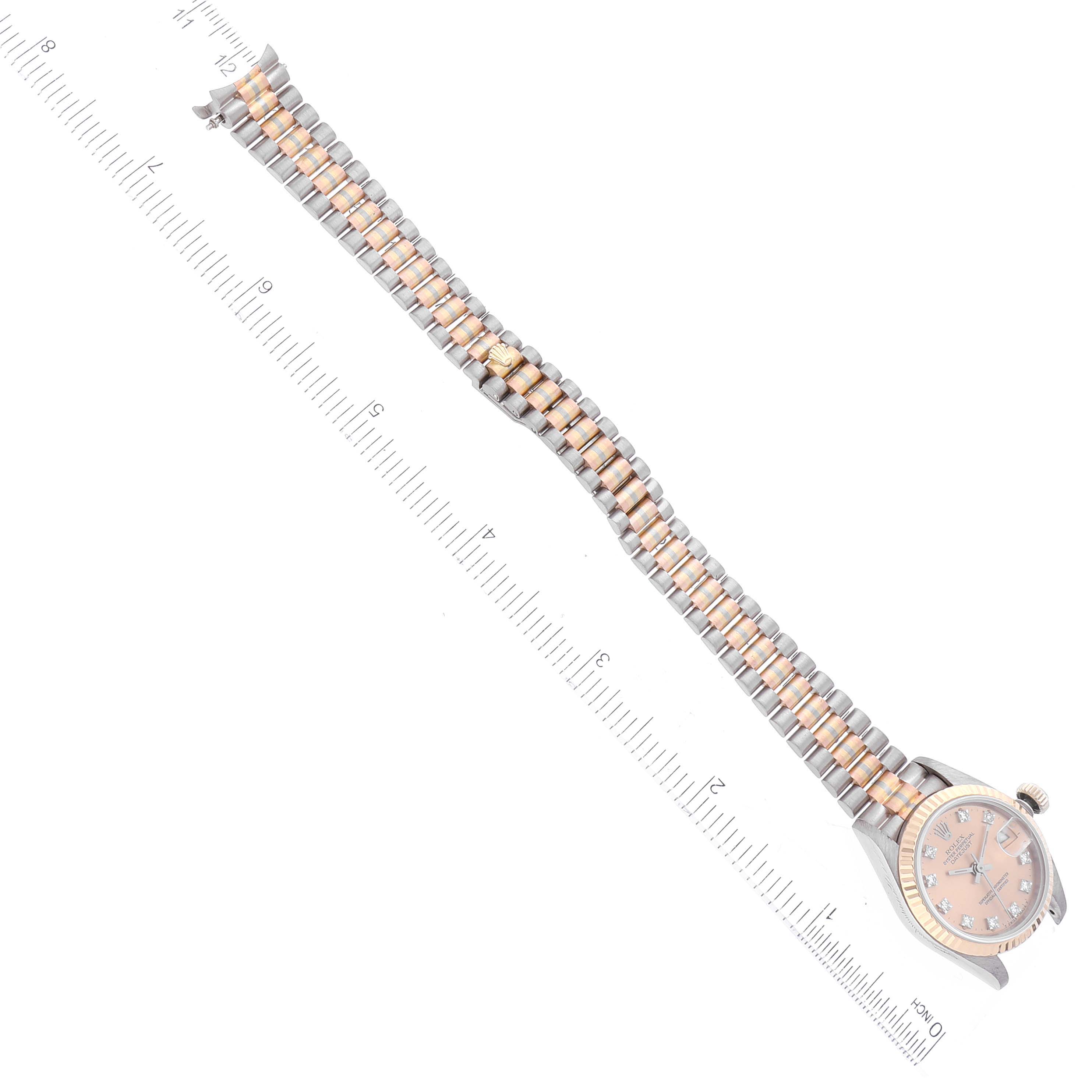 The image shows a Rolex President 69179 Women's White Gold Champagne Dial 69179 Women's White Gold Champagne Dial model watch laid flat, angled diagonally with a ruler beside it for scale.