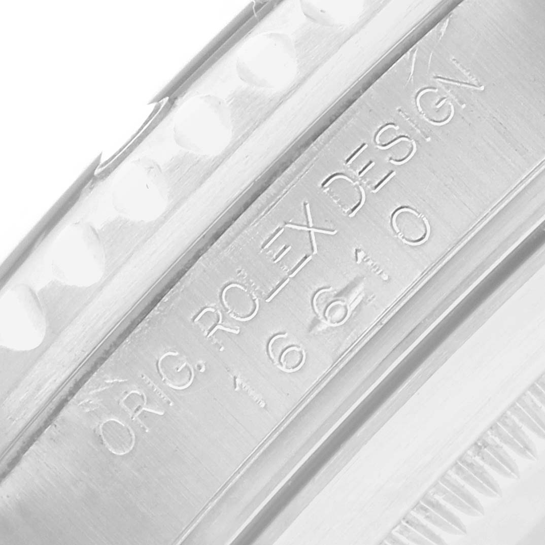 The image shows a close-up of the inner watch casing and bezel edge of a Rolex Submariner 16610 Men's Stainless Steel Black Dial.