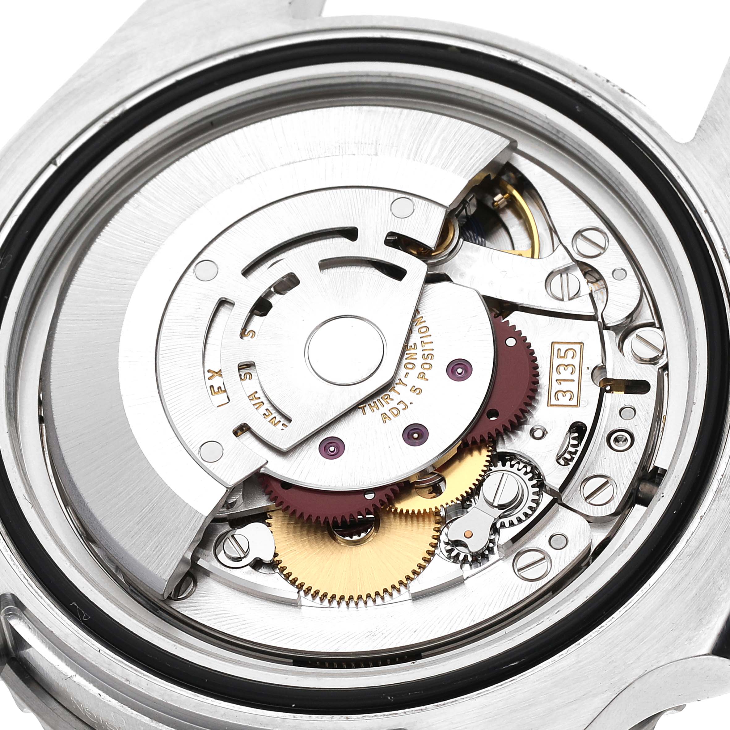 The image shows a close-up of the internal mechanism of a Rolex Submariner 116610LV Men's Stainless Steel Green Dial 116610LV Men's Stainless Steel Green Dial, highlighting the gears and rotor.