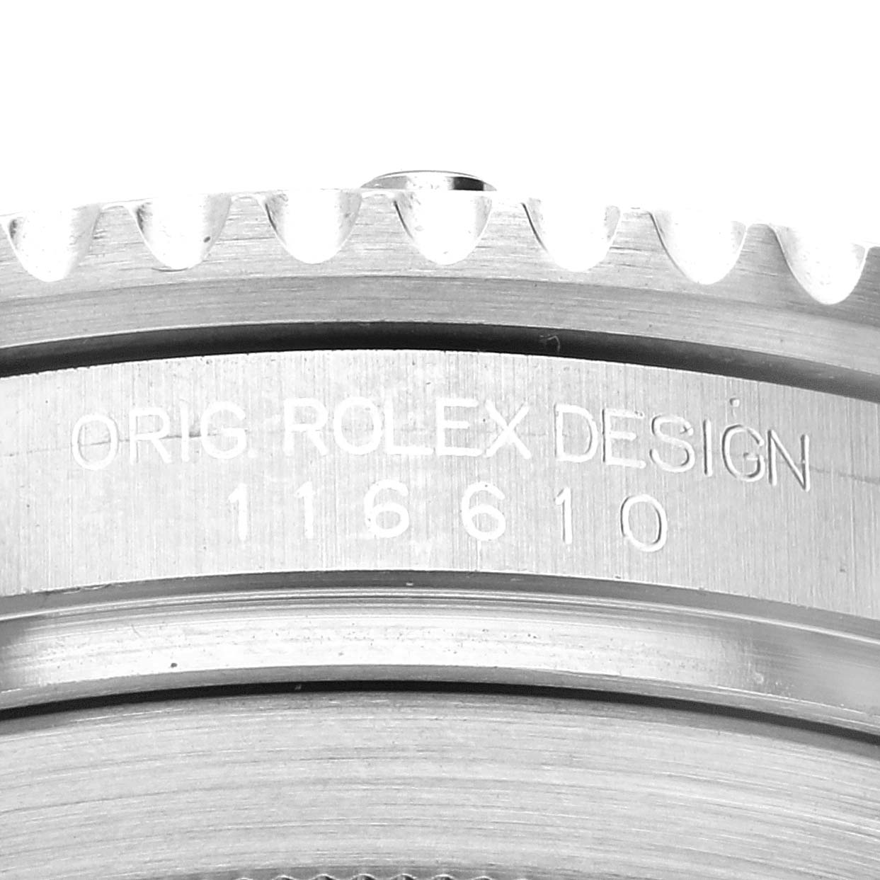 The image shows a close-up of the model number "116610" and "ORIG ROLEX DESIGN" engraving on the bezel edge of the Rolex Submariner 116610LV Men's Stainless Steel Green Dial 116610LV Men's Stainless Steel Green Dial watch.