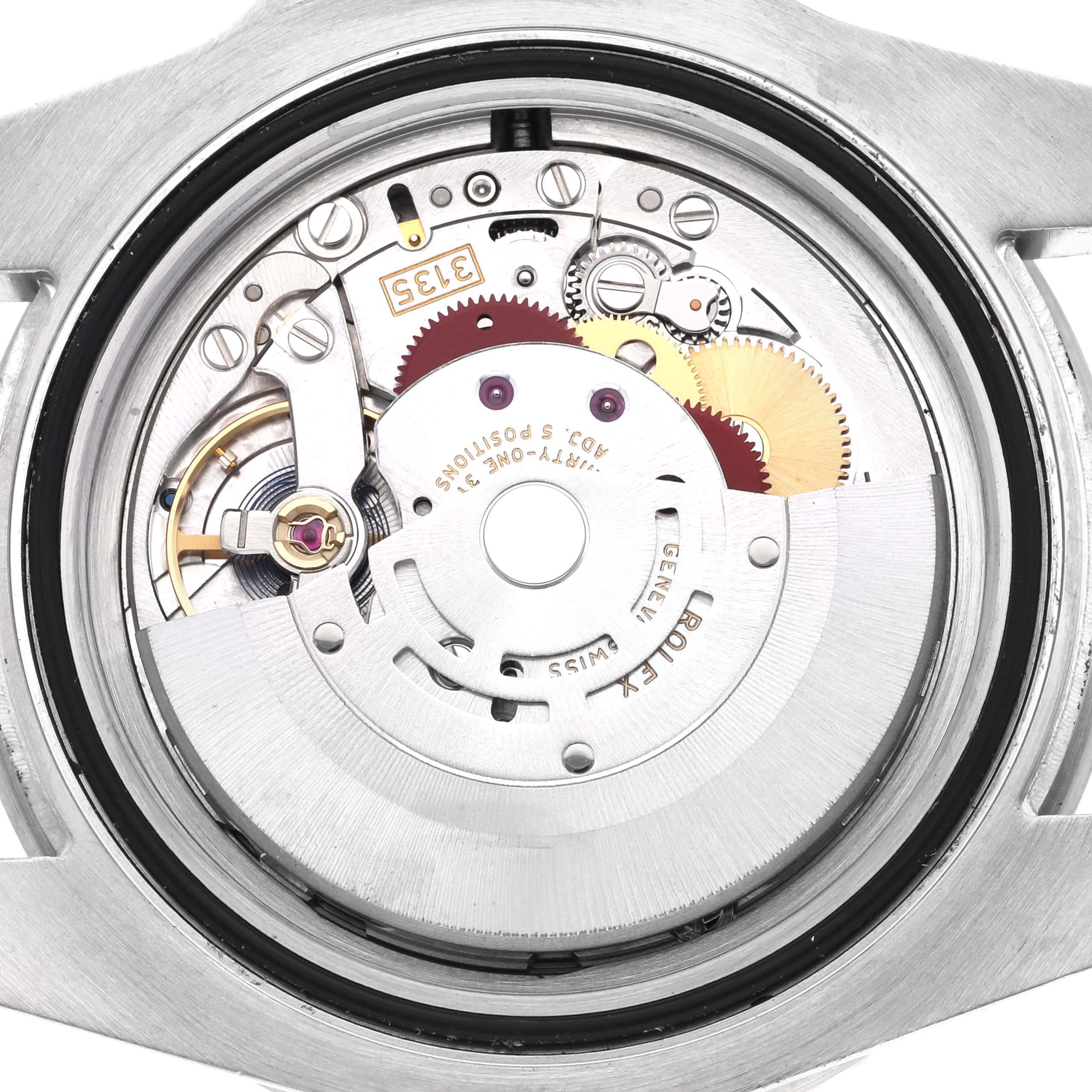 The image shows the back view of the Rolex Submariner 116610LV Men's Stainless Steel Green Dial, highlighting its intricate movement components.