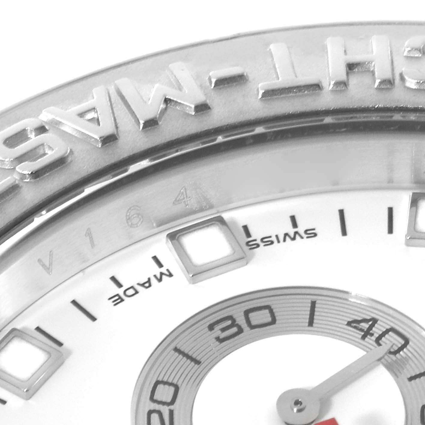 The image shows a close-up of a Rolex Yacht-Master 116689 Men's White Gold White Dial 116689 Men's White Gold White Dial watch, focusing on its bezel, dial, and part of the minute hand.