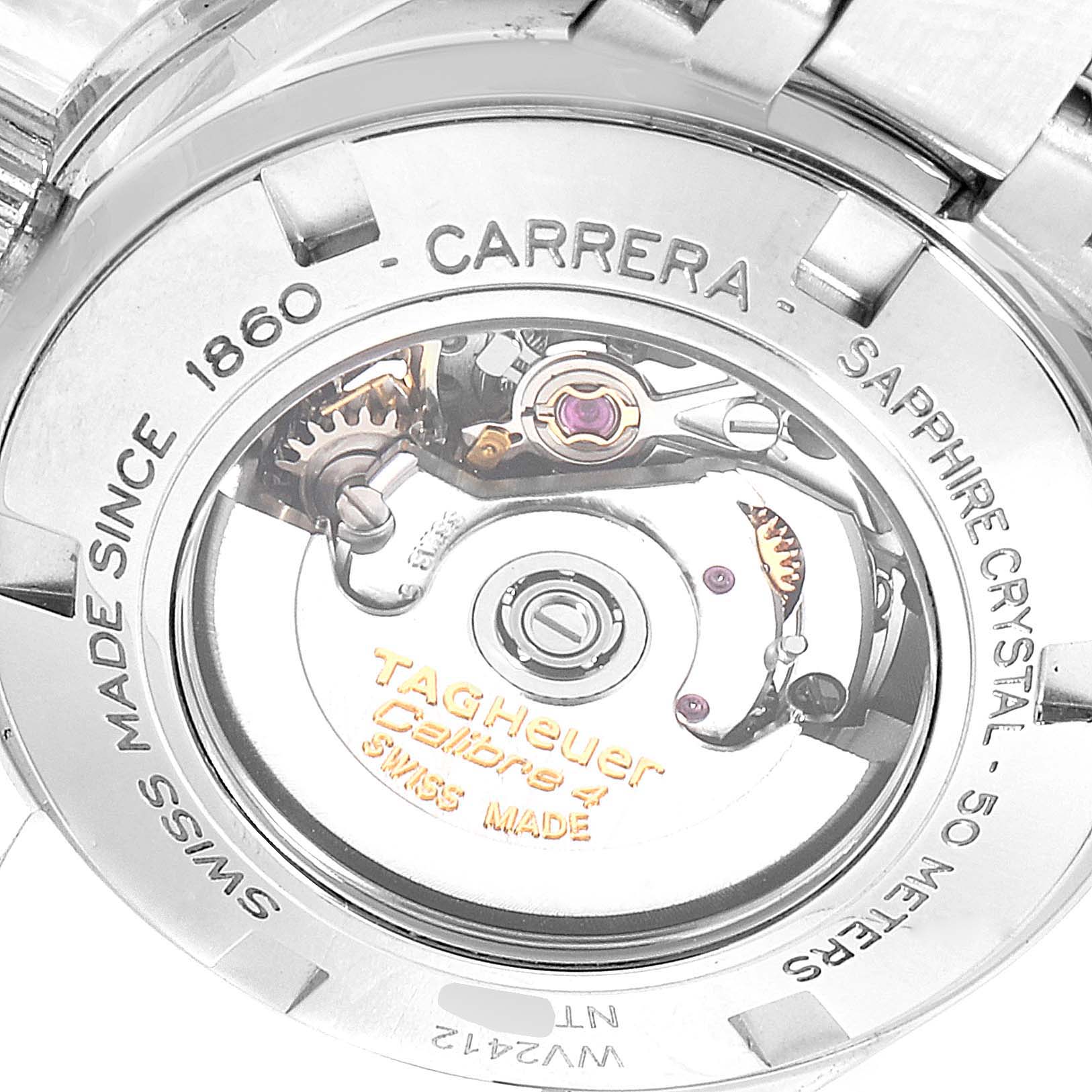 The image shows the backside of a Carrera model by Tag Heuer, highlighting its mechanical movement parts and inscriptions.