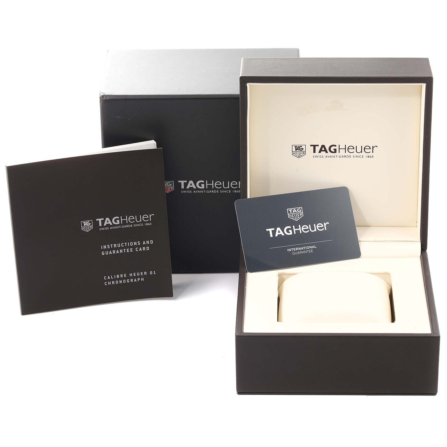 The image shows the box, instruction manual, guarantee card, and watch case for a Tag Heuer Carrera CAR2A1Z.FT6044 Men's Stainless Steel Black Dial CAR2A1Z.FT6044 Men's Stainless Steel Black Dial model watch.