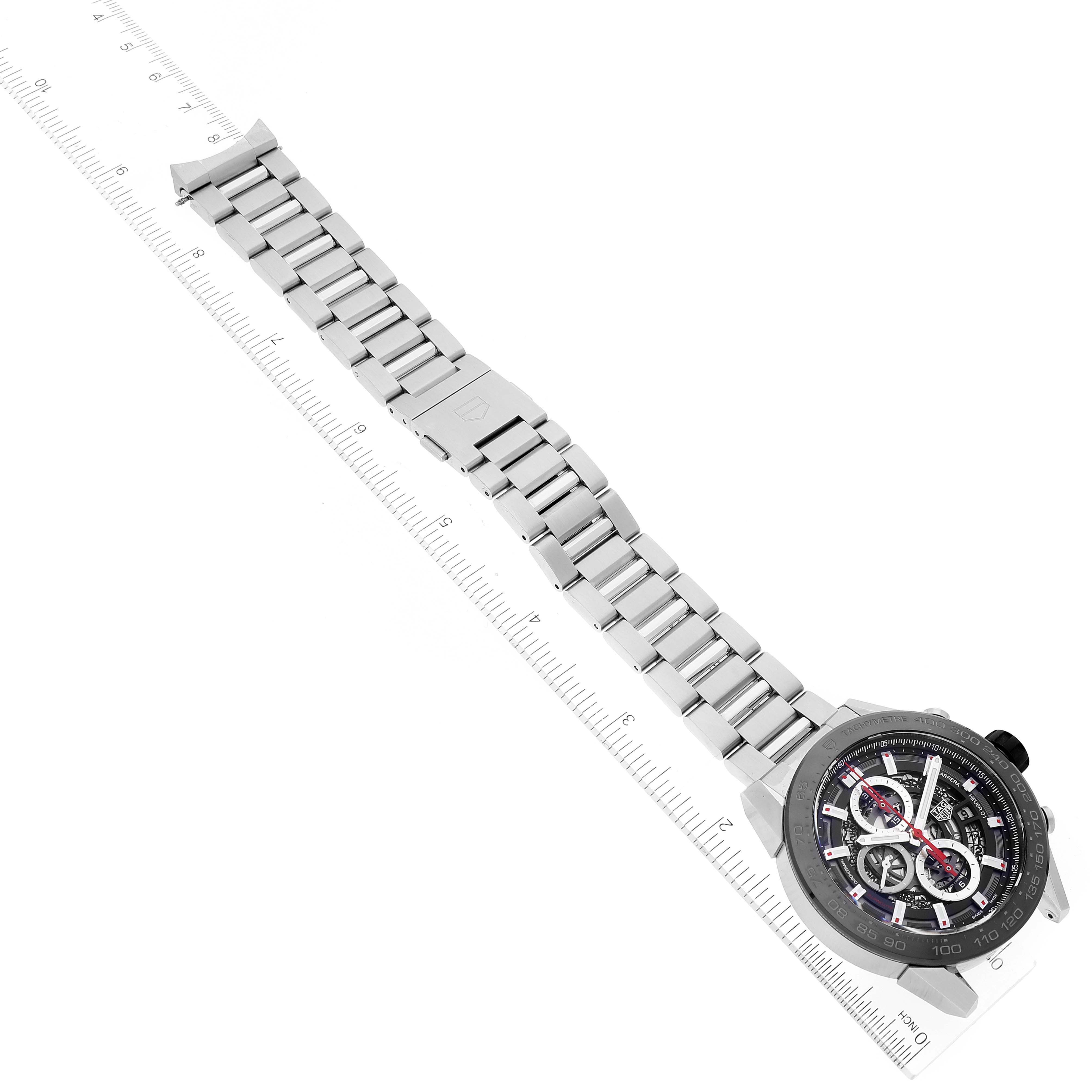 The image shows a Tag Heuer Carrera CAR2A1W.BA0703 Men's Stainless Steel Transparent Dial CAR2A1W.BA0703 Men's Stainless Steel Transparent Dial watch laid flat with a stainless steel bracelet, viewed from a top-down angle.