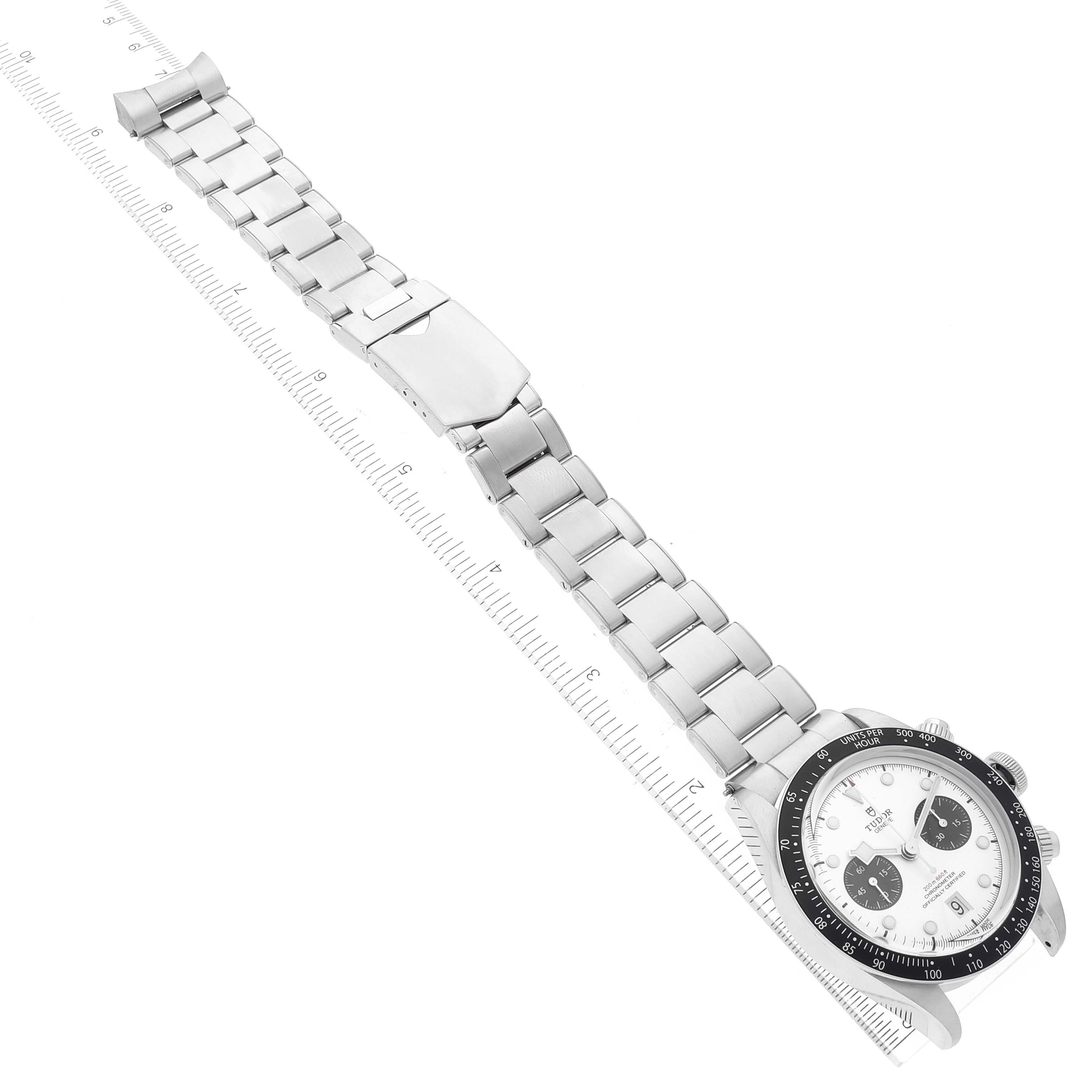 The image shows a Tudor Heritage Black Bay M79360N-0002 Men's Stainless Steel Silver Dial M79360N-0002 Men's Stainless Steel Silver Dial watch from a top view, highlighting the face and full bracelet, alongside a ruler for scale.