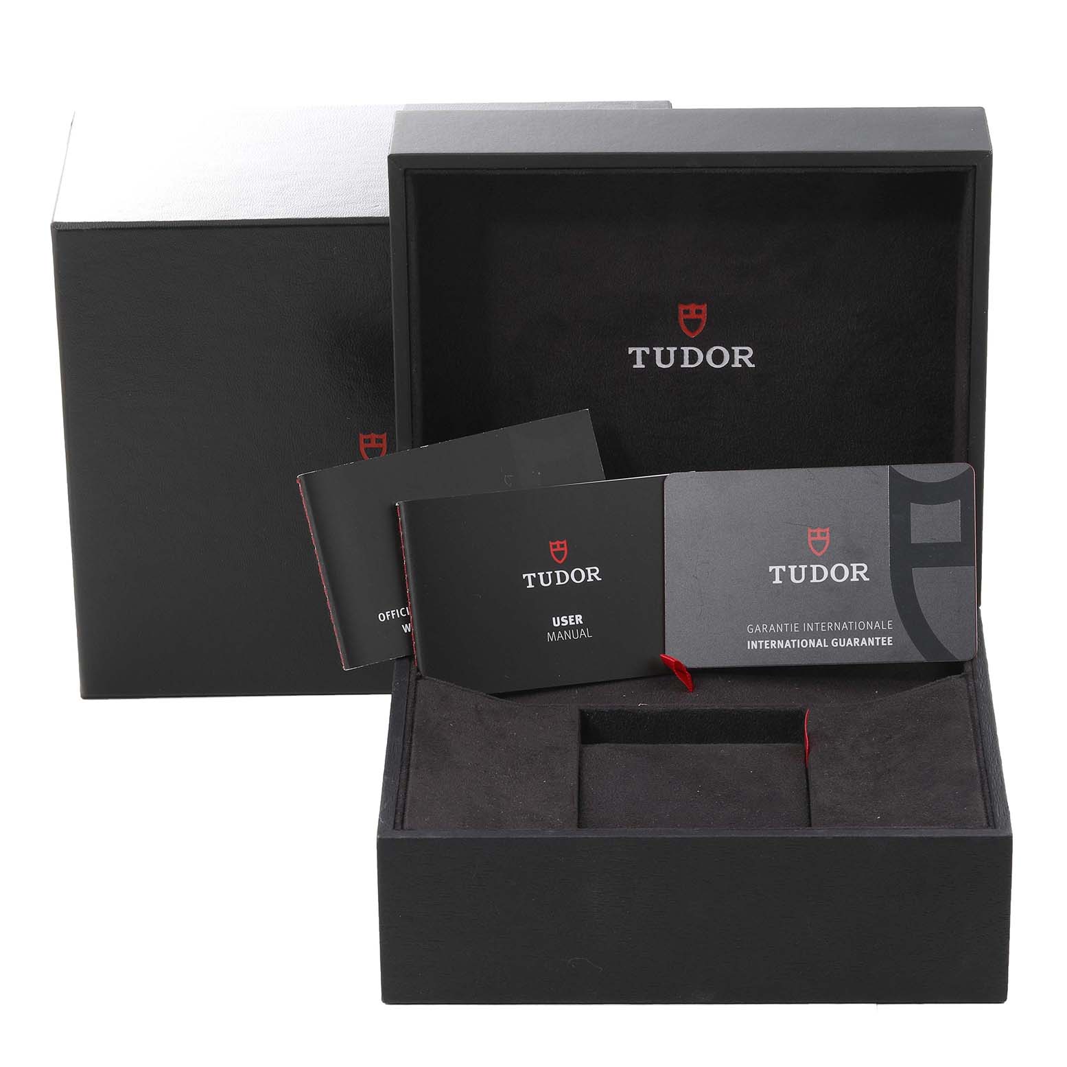 The image shows the packaging and manuals for the Tudor Heritage Black Bay M79360N-0002 Men's Stainless Steel Silver Dial M79360N-0002 Men's Stainless Steel Silver Dial watch, including the box, user manual, and warranty.