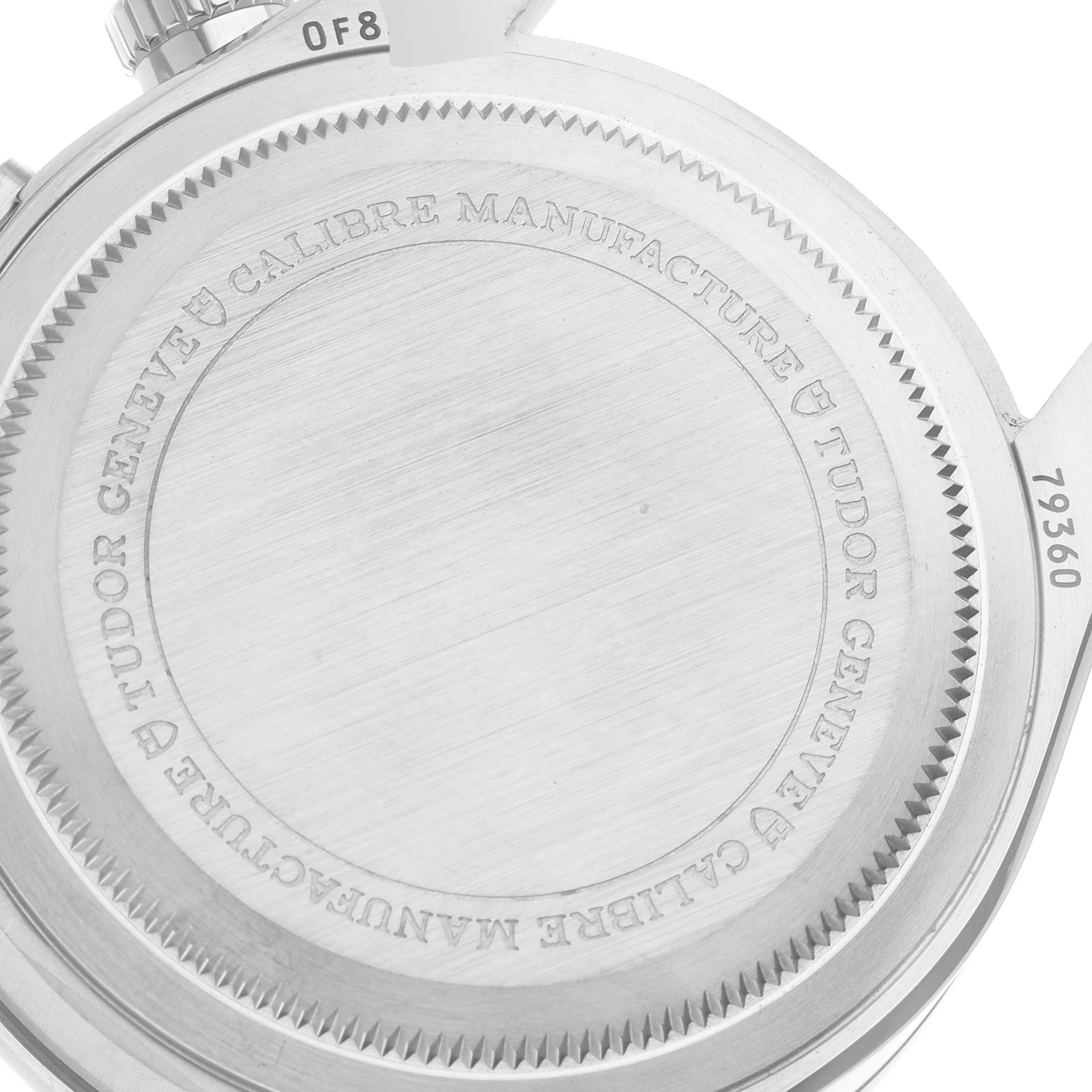 The image shows the back case of a Tudor Heritage Black Bay M79360N-0002 Men's Stainless Steel Silver Dial M79360N-0002 Men's Stainless Steel Silver Dial watch, featuring its engravings and serial number.