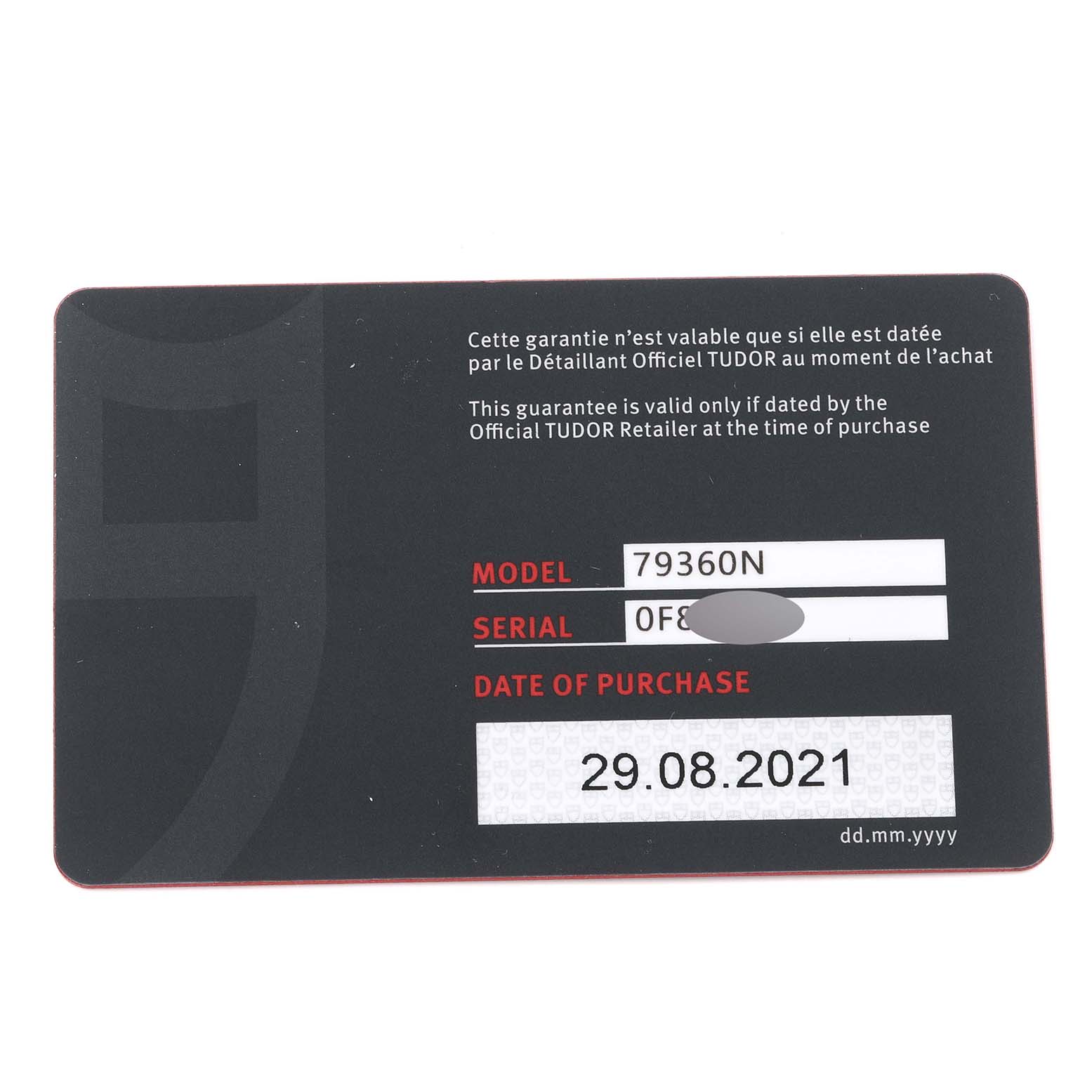 This is a close-up of a warranty card for the Tudor Heritage Black Bay M79360N-0002 Men's Stainless Steel Silver Dial M79360N-0002 Men's Stainless Steel Silver Dial model 79360N, showing serial number and purchase date.