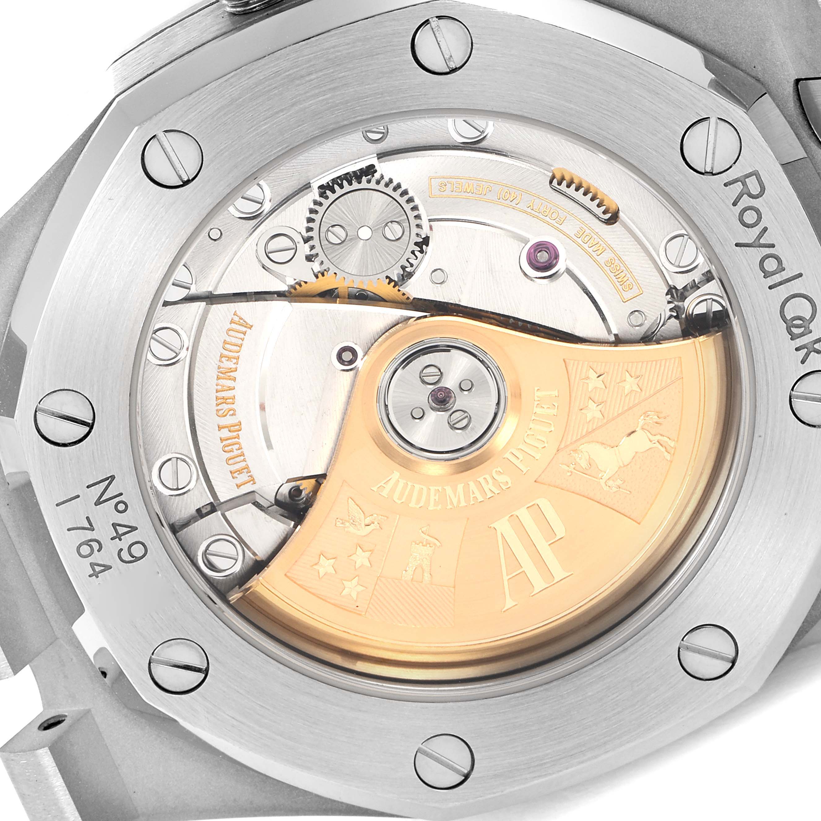 The image shows the back of the Royal Oak by Audemars Piguet exposing its intricate mechanical movement.