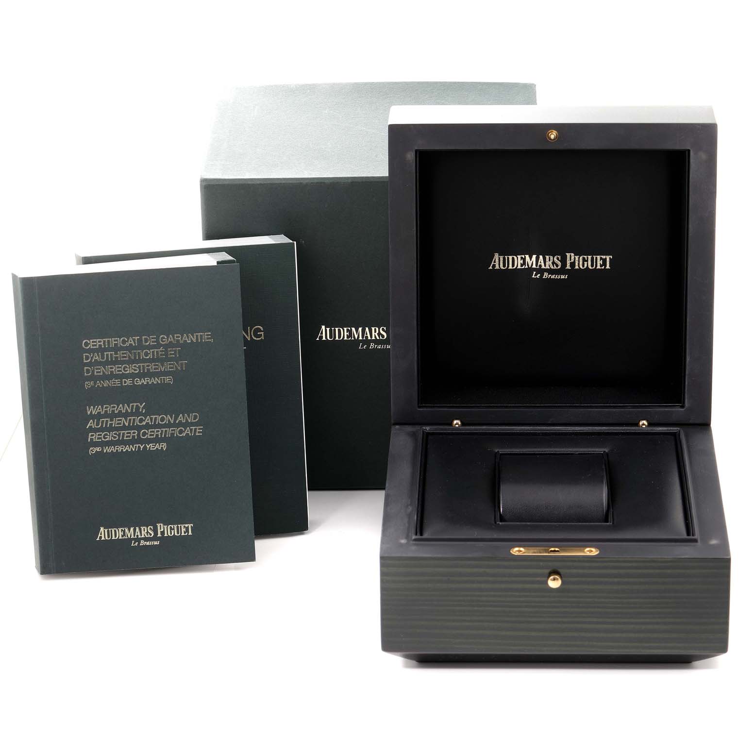 The image shows the packaging and accessories for an Audemars Piguet Royal Oak 15450ST.OO.1256ST.01 Men's Stainless Steel Silver Dial 15450ST.OO.1256ST.01 Men's Stainless Steel Silver Dial watch, including a box and warranty booklets.