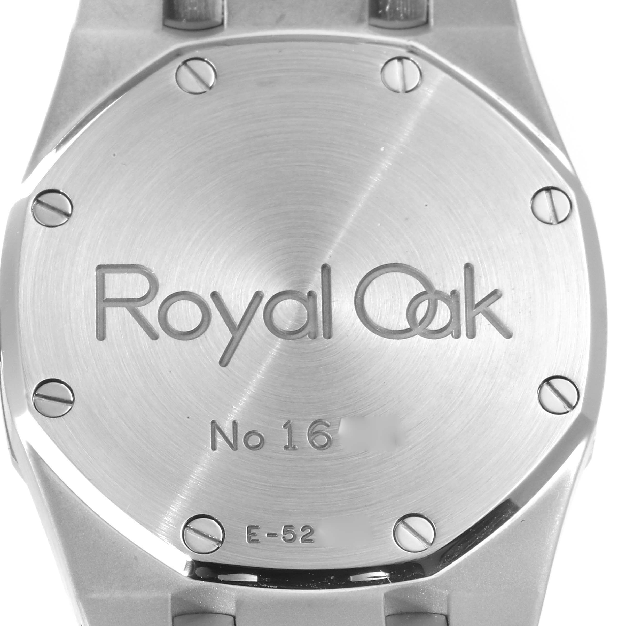 This image shows the back case of a Royal Oak watch by Audemars Piguet, highlighting the engraved model details and screws.