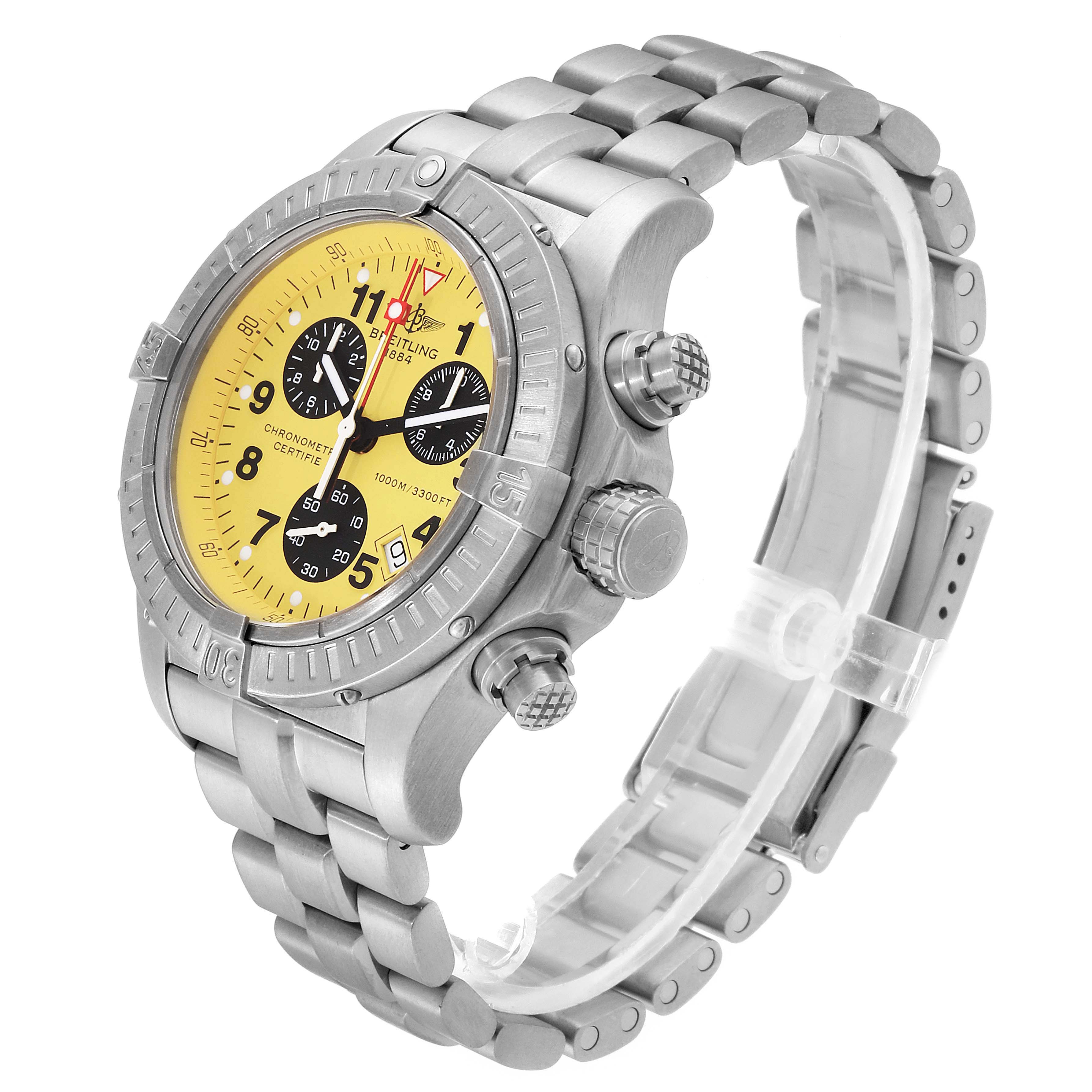 The image shows a Breitling Avenger E73360 Men's Titanium Yellow Dial E73360 Men's Titanium Yellow Dial watch at a three-quarter angle, highlighting the bezel, dial, pushers, and bracelet.