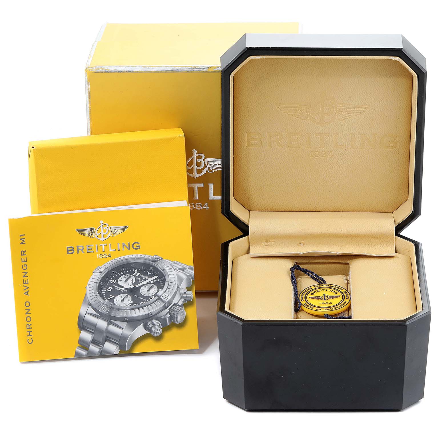 The image shows the Breitling Avenger E73360 Men's Titanium Yellow Dial E73360 Men's Titanium Yellow Dial watch box, manual, and tag from a frontal angle.