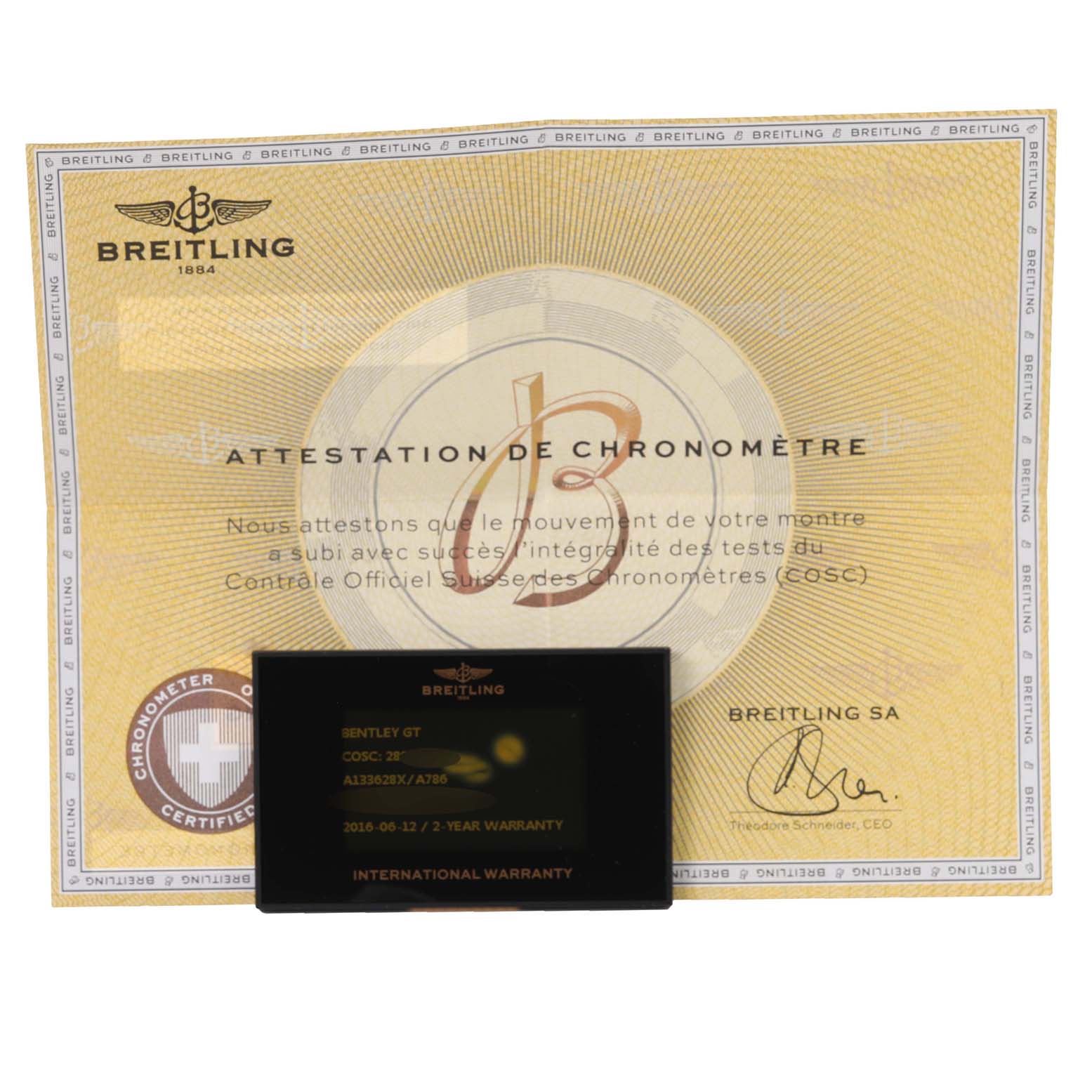 The image shows a Breitling Bentley A133628X/A786 Men
s Stainless Steel Mother of Pearl Dial A133628X/A786 Men
s Stainless Steel Mother of Pearl Dial model
s attestation de chronomètre and international warranty card.