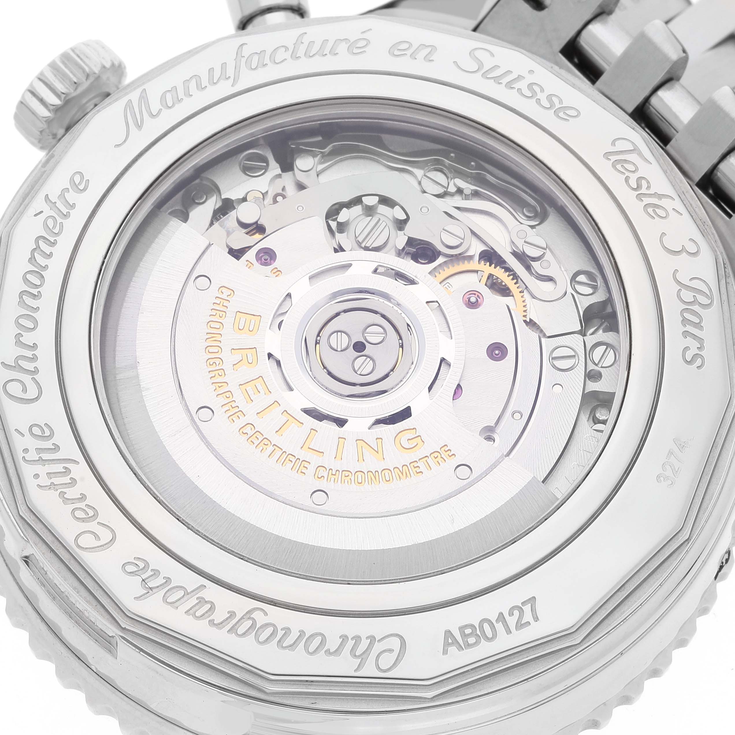 The image shows the back side of the Breitling Navitimer AB0127211C1A1 Men's Stainless Steel Blue Dial AB0127211C1A1 Men's Stainless Steel Blue Dial watch, revealing its inner mechanical movement and engraved details.