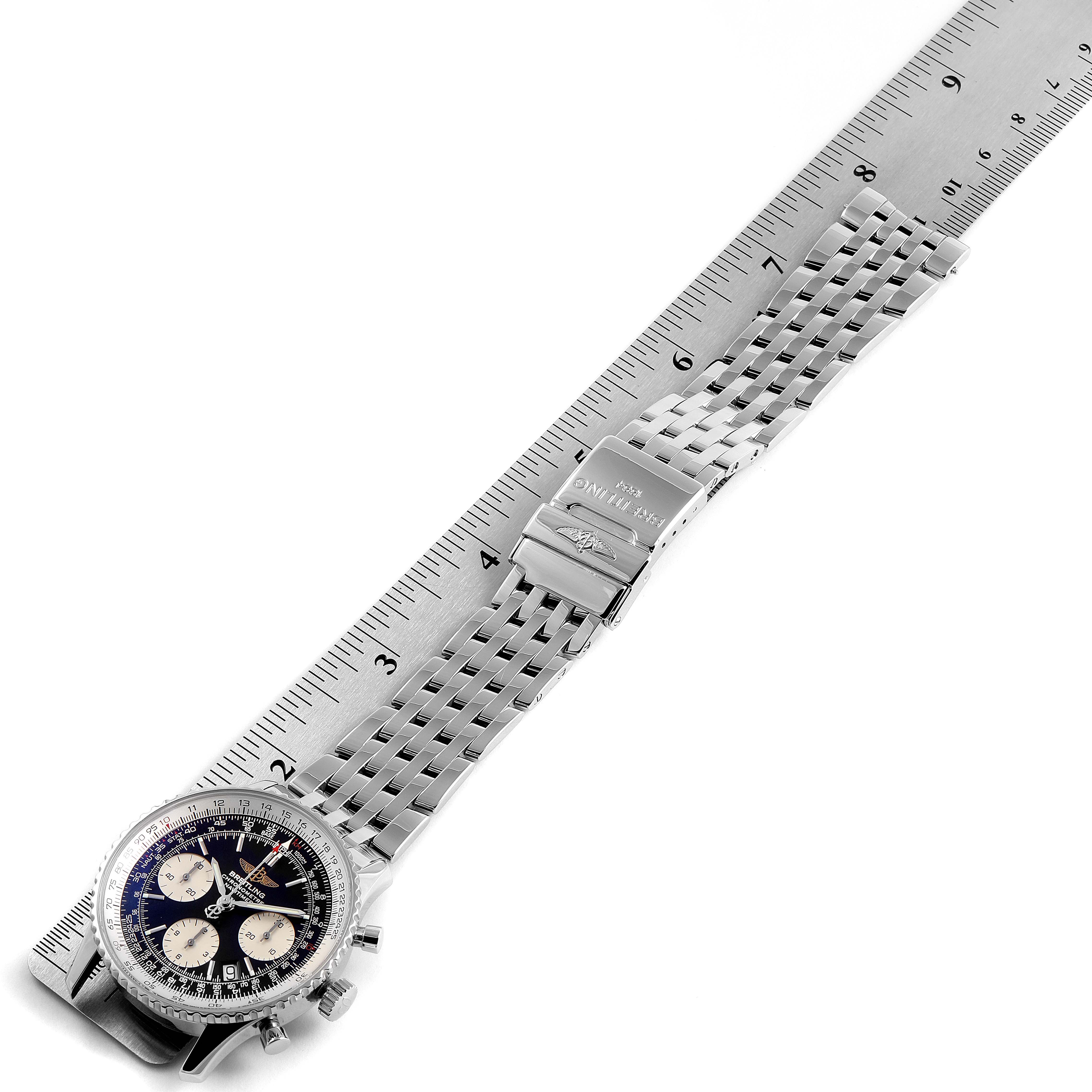 The image shows a Breitling Navitimer A23322 Men's Stainless Steel Black Dial A23322 Men's Stainless Steel Black Dial watch laid flat with a metal ruler beside it for measurement.