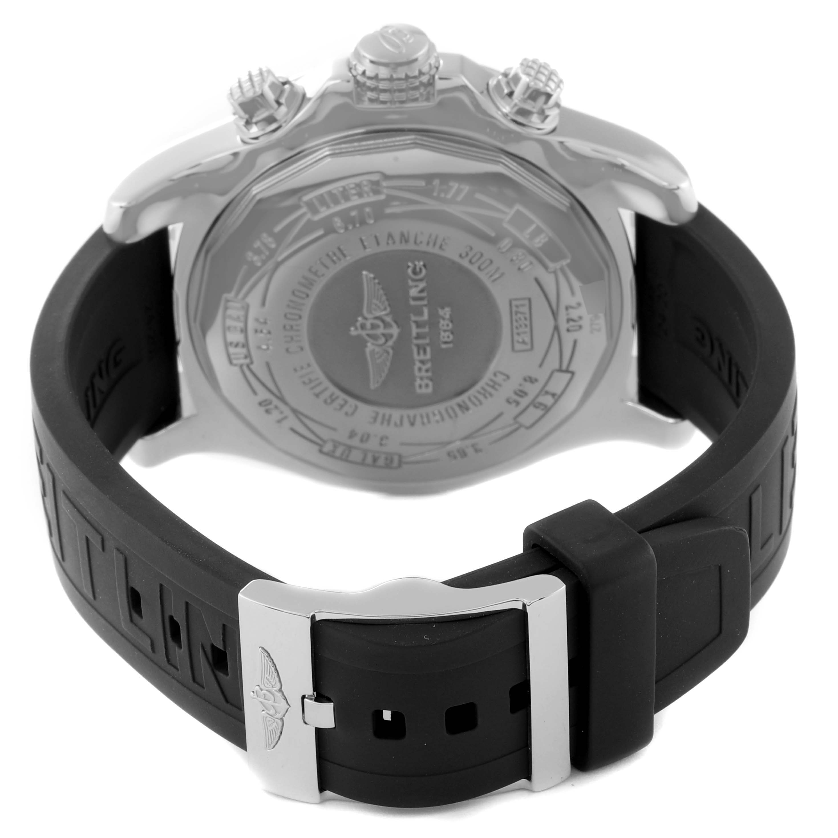 The image shows the back view of a Breitling Avenger A13371 Men's Stainless Steel Black Dial A13371 Men's Stainless Steel Black Dial watch, featuring its case back, crown, and black rubber strap with a clasp.