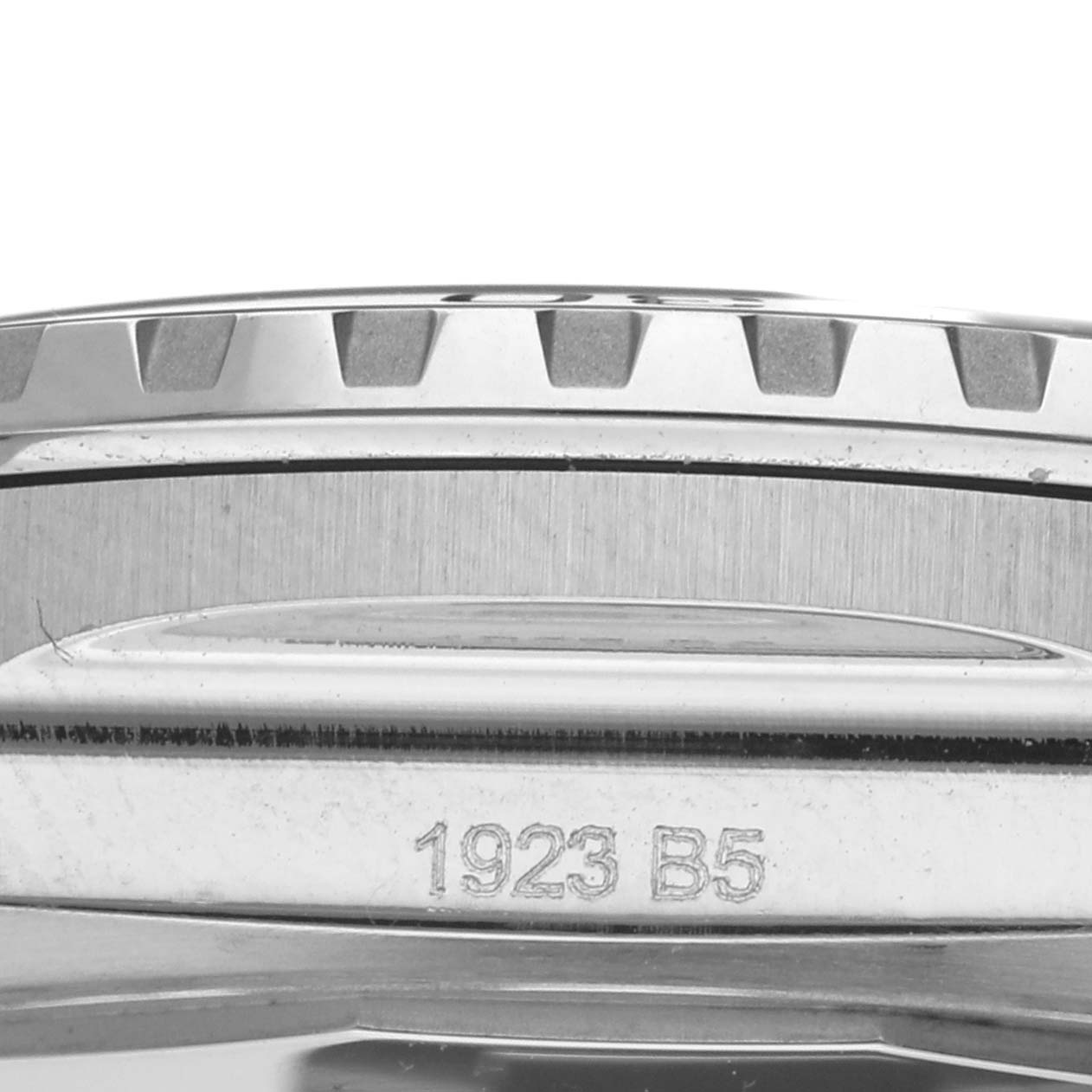 This close-up image of the Breitling Superocean A17378E71C1A Men
s Stainless Steel Black Dial A17378E71C1A Men
s Stainless Steel Black Dial watch shows part of the case and the bezel with engraved markings "1923 B5".