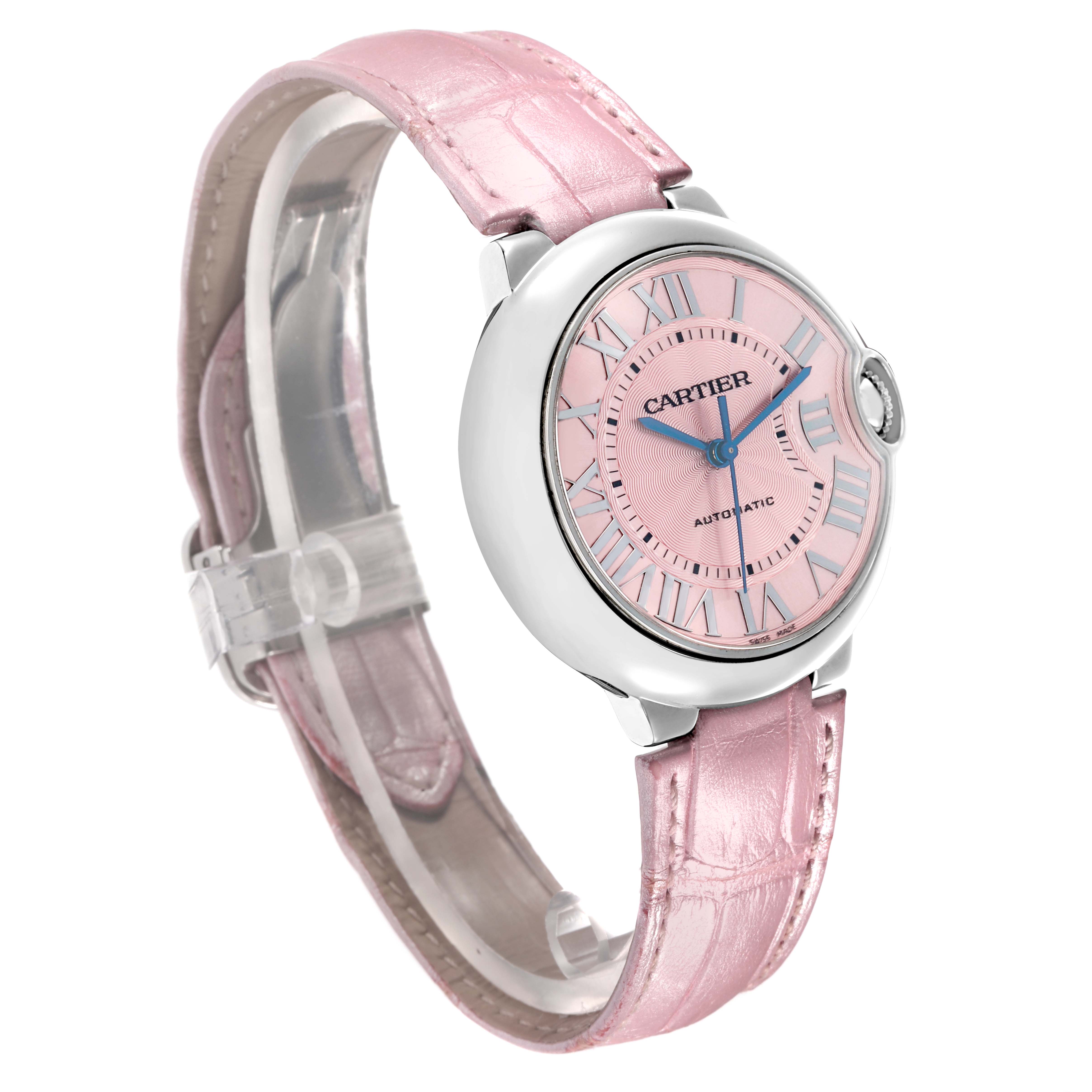 The Cartier Ballon Bleu WSBB0007 Women
s Stainless Steel Pink Dial watch is shown at a slight angle highlighting its pink dial, Roman numerals, and pink leather strap.