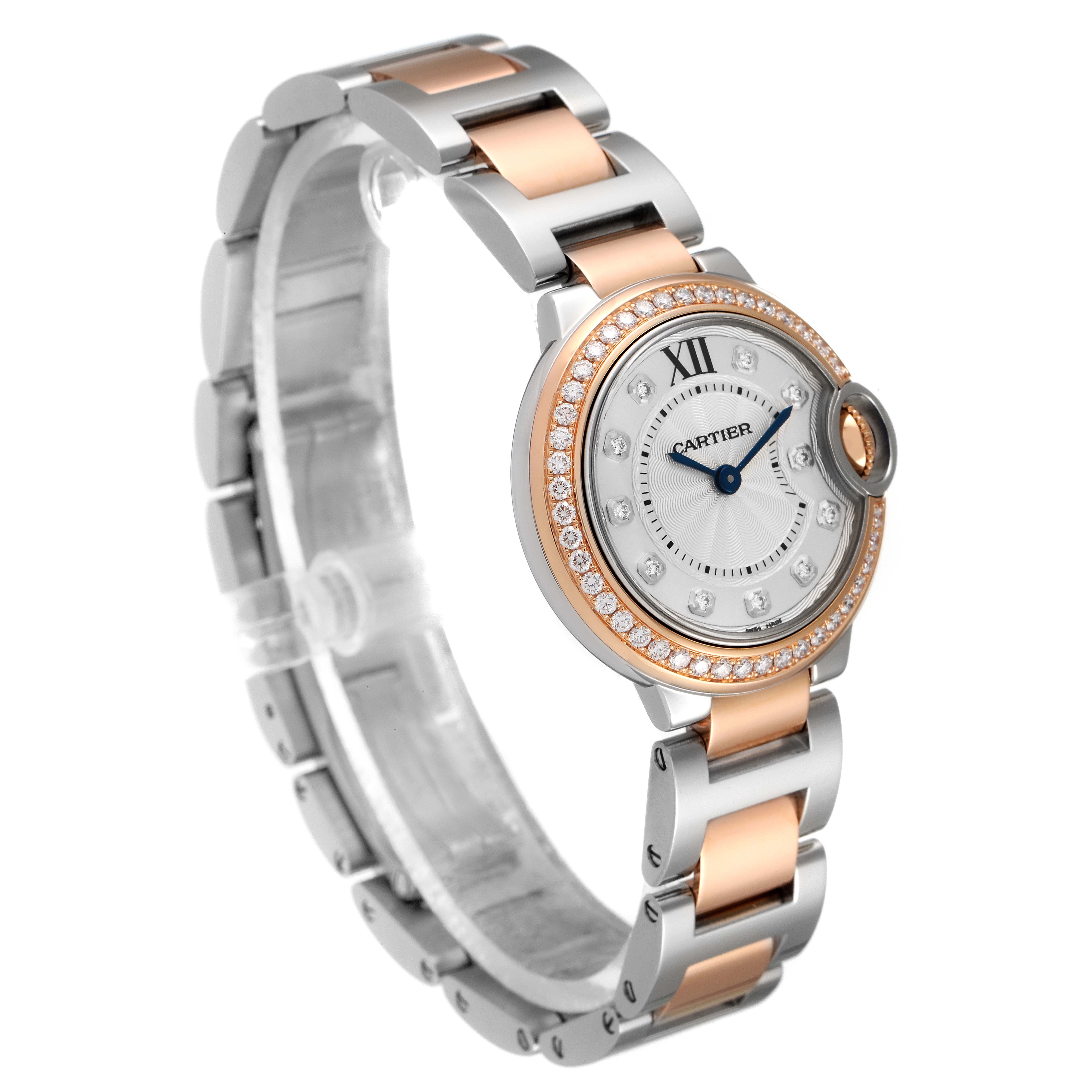 This image shows a Cartier Ballon Bleu W3BB0009 Women's Steel and Gold (two tone) Silver Dial W3BB0009 Women's Steel and Gold (two tone) Silver Dial watch from a three-quarter angle, highlighting the face, bezel, and two-tone bracelet.
