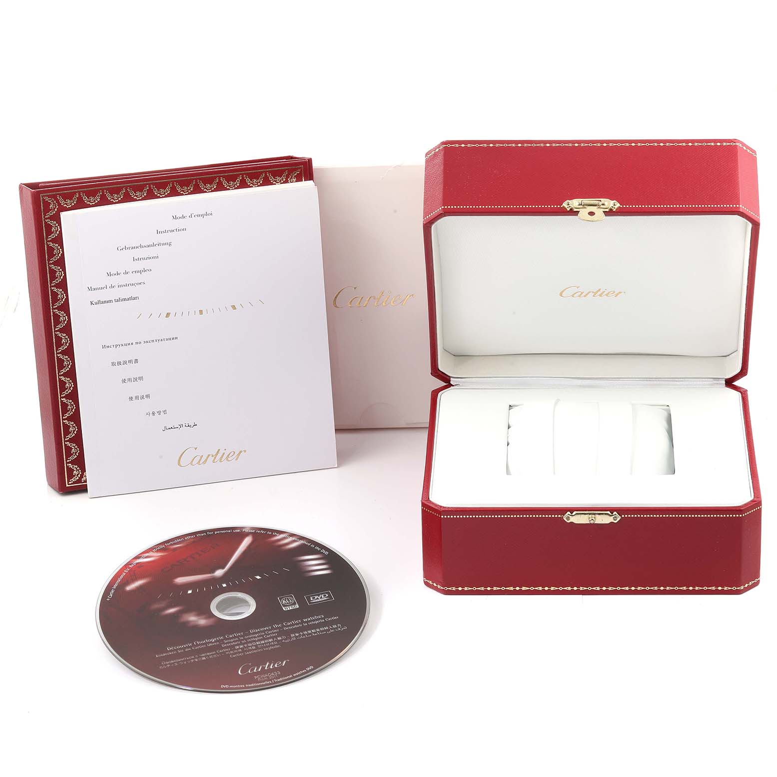 The image shows the packaging and accessories for the Cle de Cartier watch, including a box, manual, and DVD.