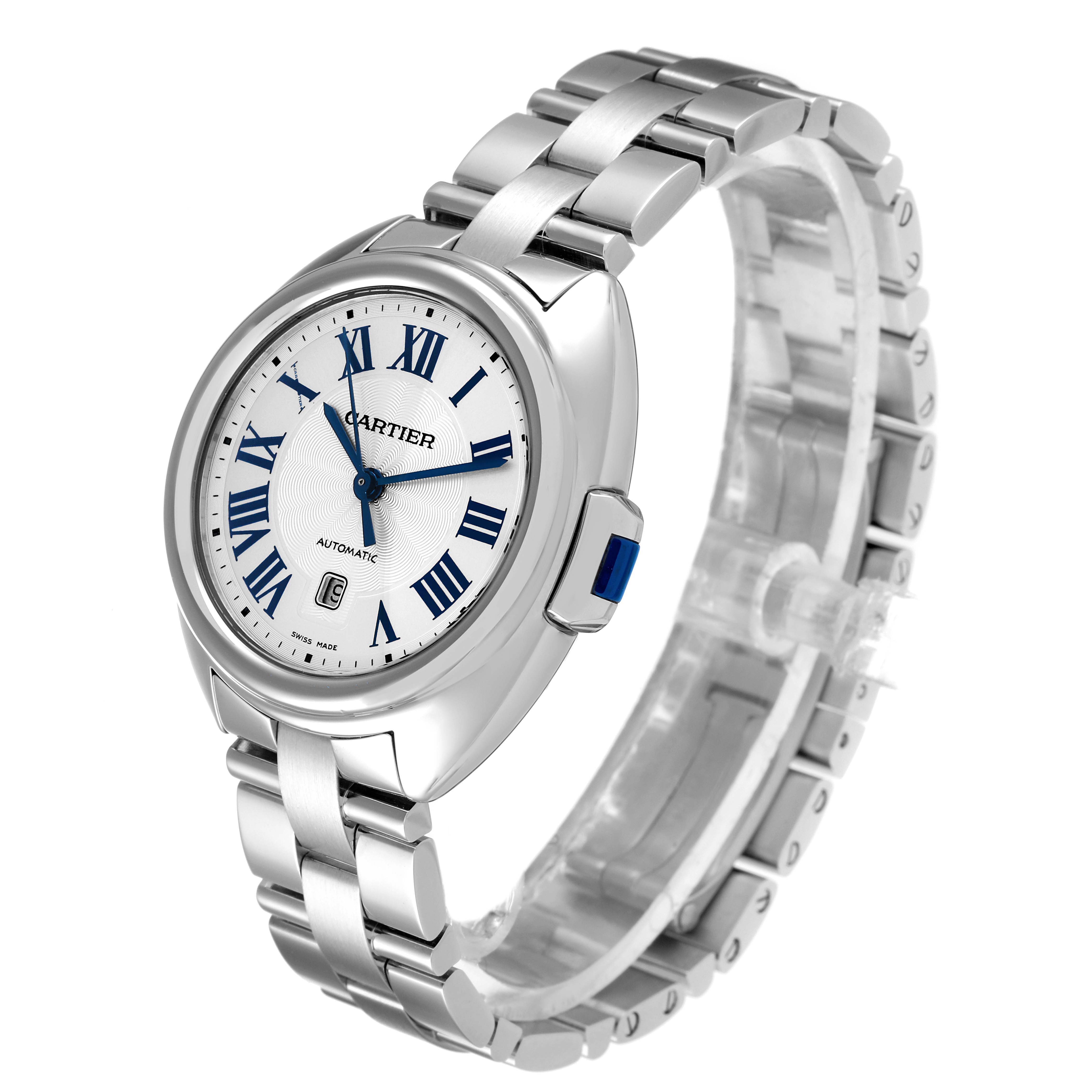 The Cartier Clé watch is shown at a 3/4 angle, displaying the face, bezel, and metal bracelet.