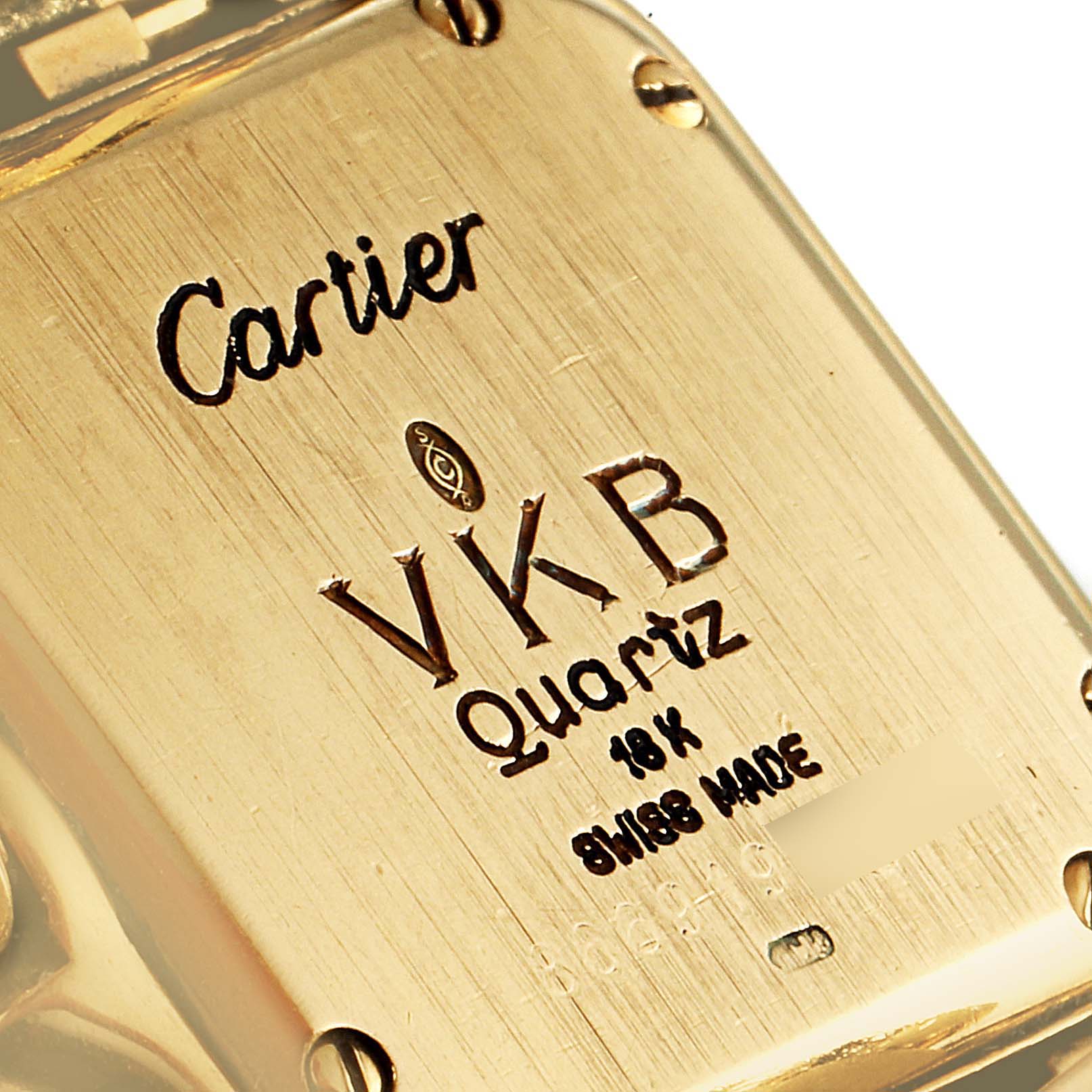 The image shows a close-up of the back of a Cartier Panthere Women's Yellow Gold Champagne Dial Women's Yellow Gold Champagne Dial model watch, highlighting the brand, model, and material details.