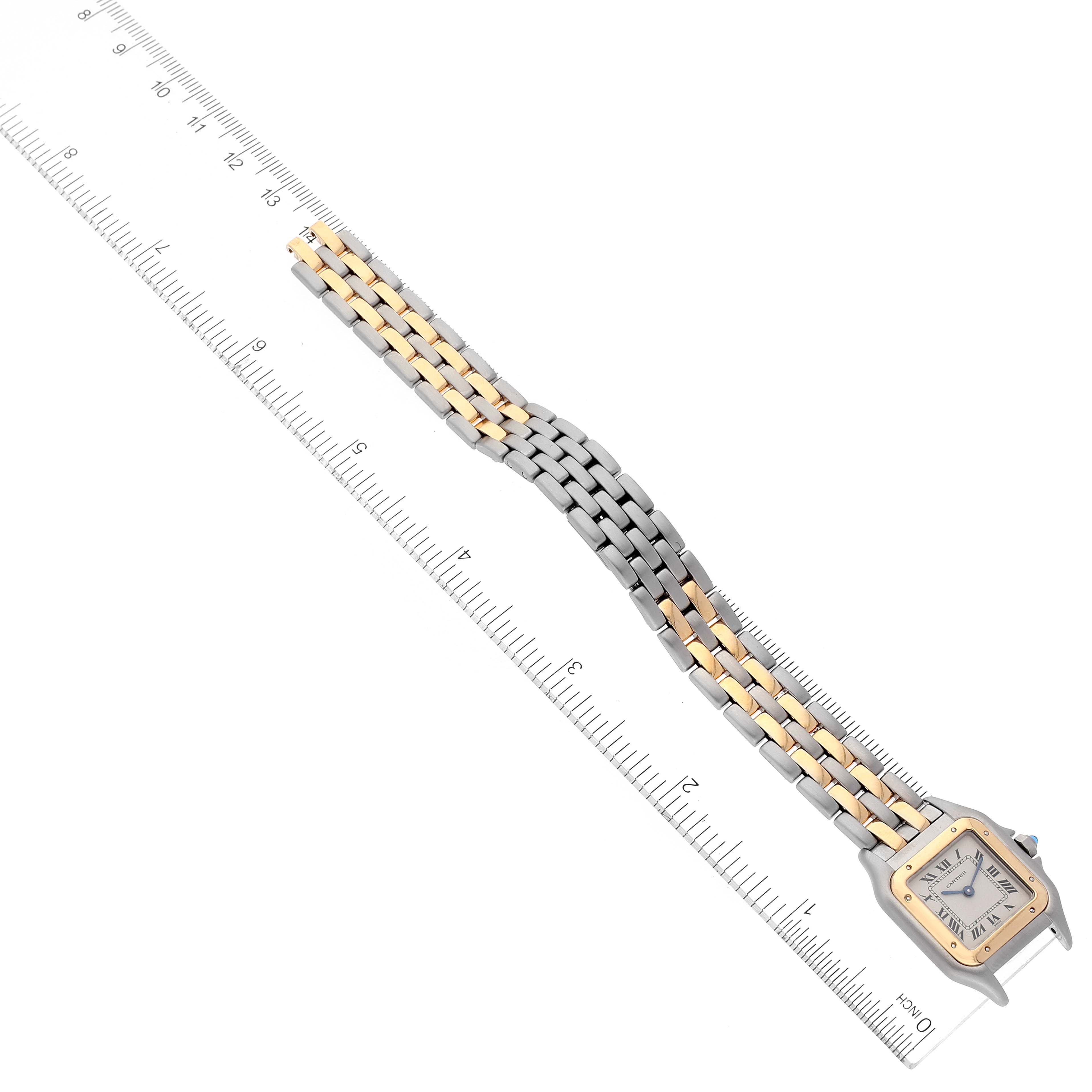 The image shows a Cartier Panthere W25029B6 Women's Yellow Gold Silver Dial W25029B6 Women's Yellow Gold Silver Dial watch laid flat with its face and bracelet aligned next to a ruler for measurement.