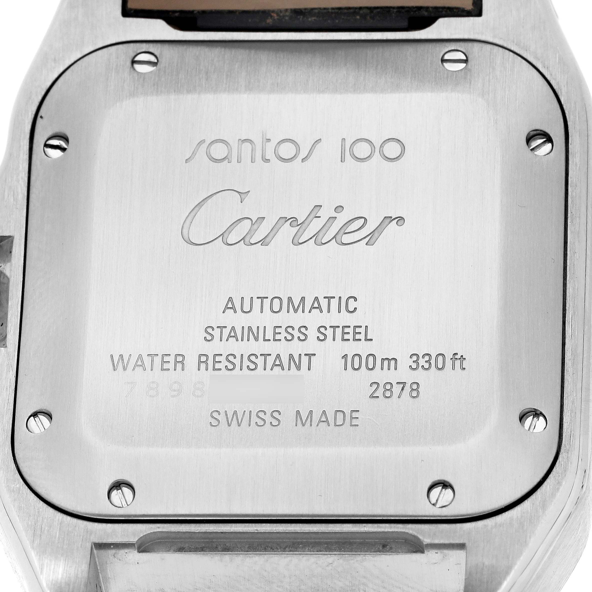 The image shows the back of a Cartier Santos W20126X8 Men
s Stainless Steel Silver Dial model watch, highlighting the inscription details and screws.