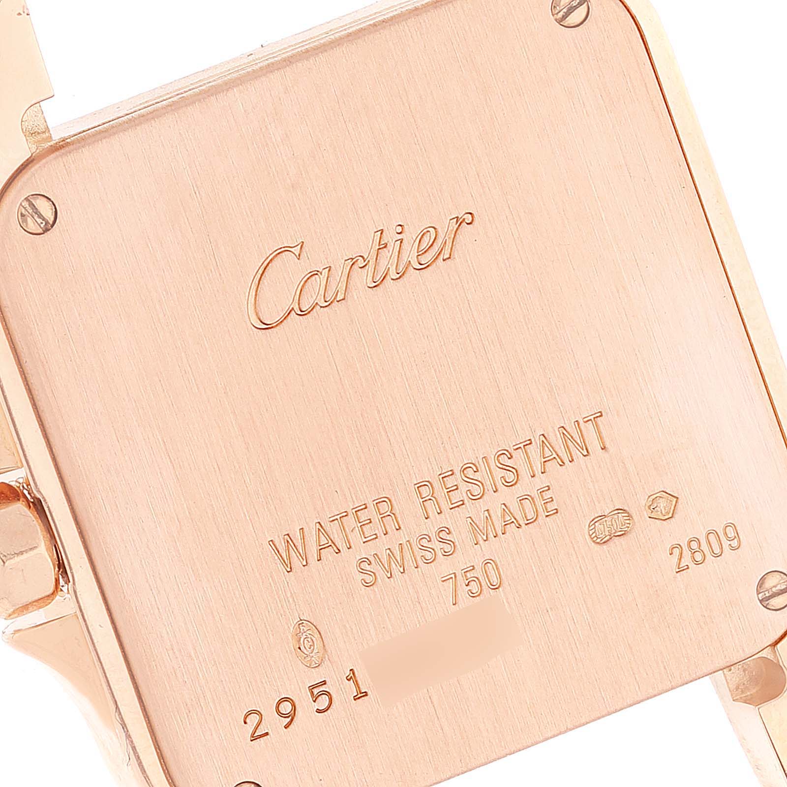 The image shows the case back of the Cartier Santos Demoiselle WF9007Z8 Women's Rose Gold Silver Dial WF9007Z8 Women's Rose Gold Silver Dial watch, detailing its water resistance and other specifications.