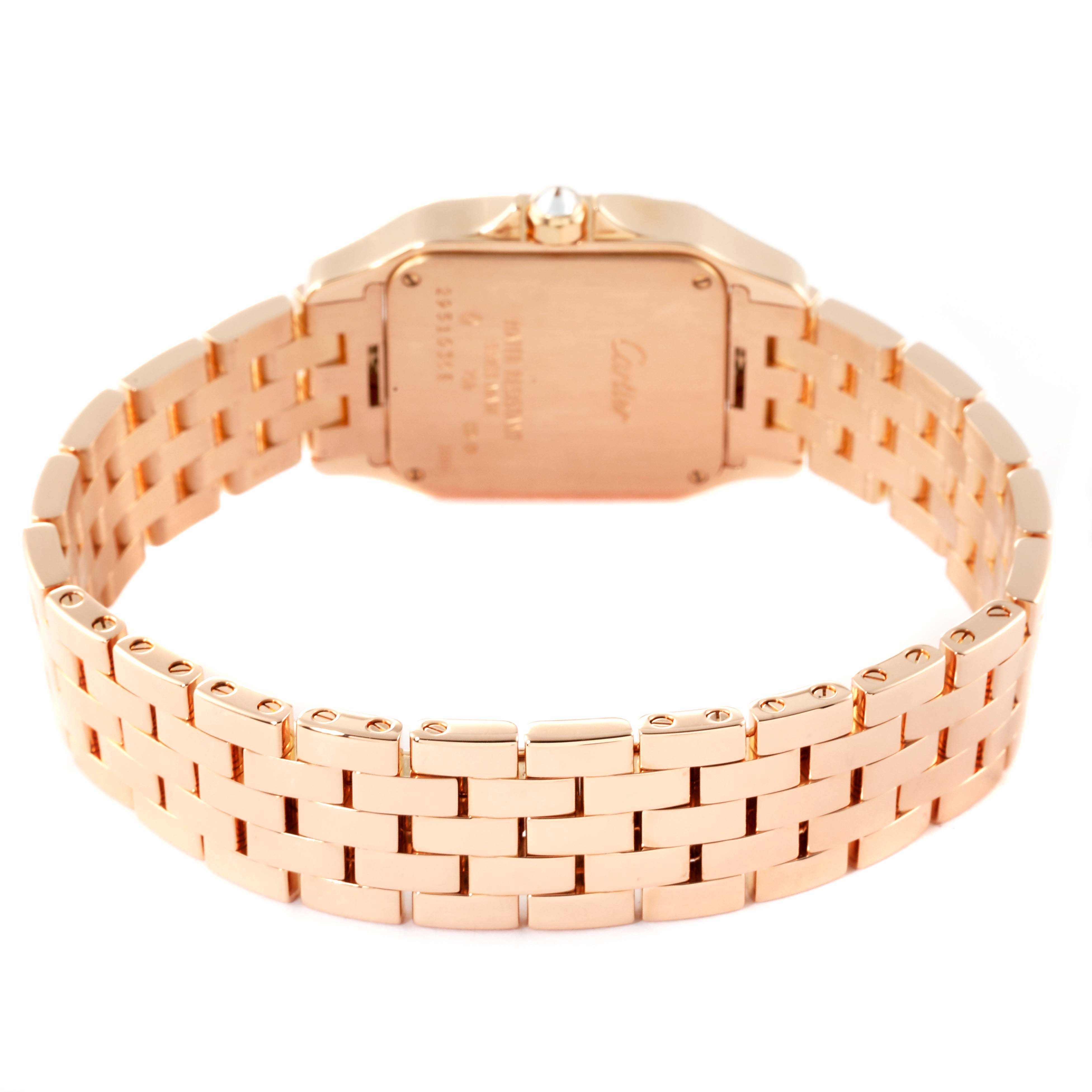 The image shows the back and bracelet of a gold Cartier Santos Demoiselle WF9007Z8 Women's Rose Gold Silver Dial WF9007Z8 Women's Rose Gold Silver Dial watch.