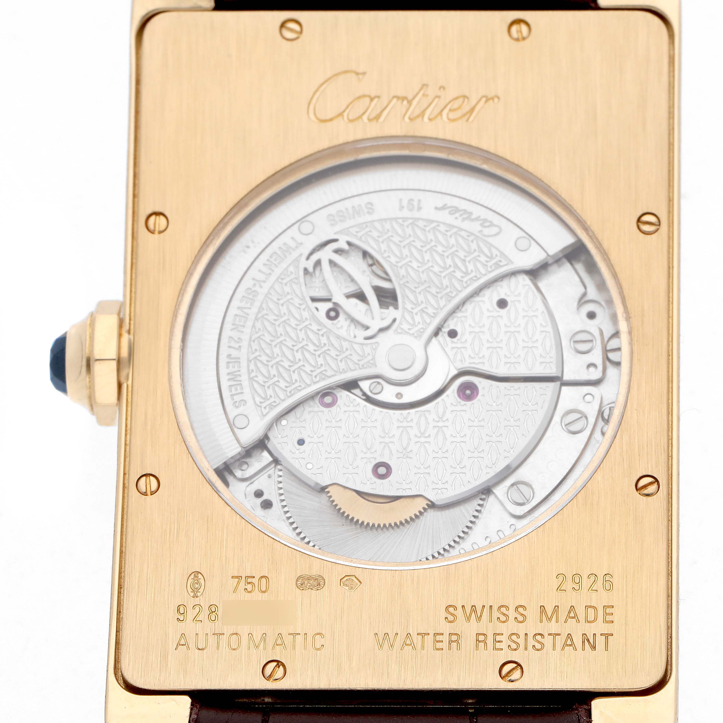 The image shows the back of a Cartier Tank Americaine W2609756 Men
s Yellow Gold Silver Dial watch, highlighting its automatic movement and inscriptions.