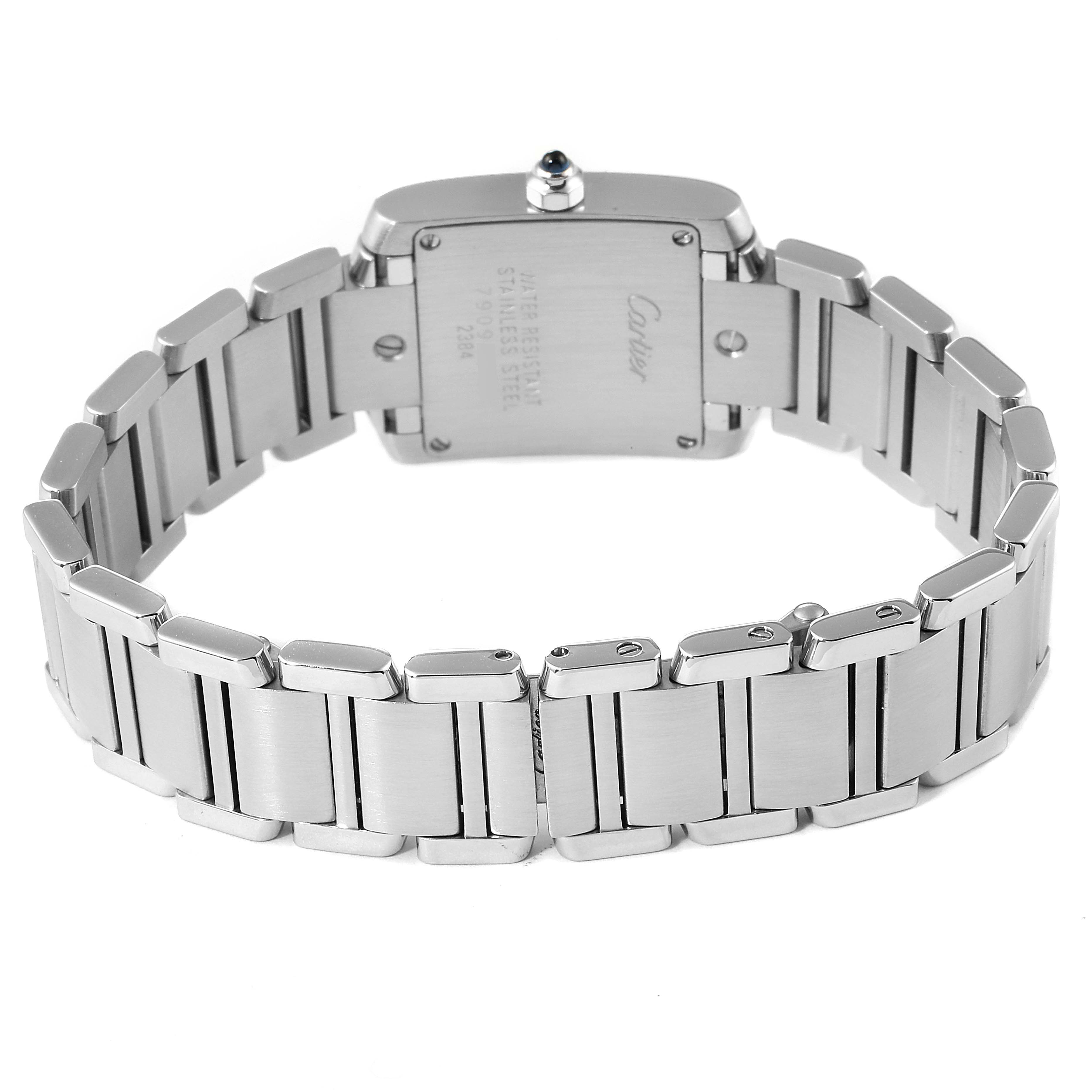 The image shows the back and bracelet of a Cartier Tank Française watch from a low angle.