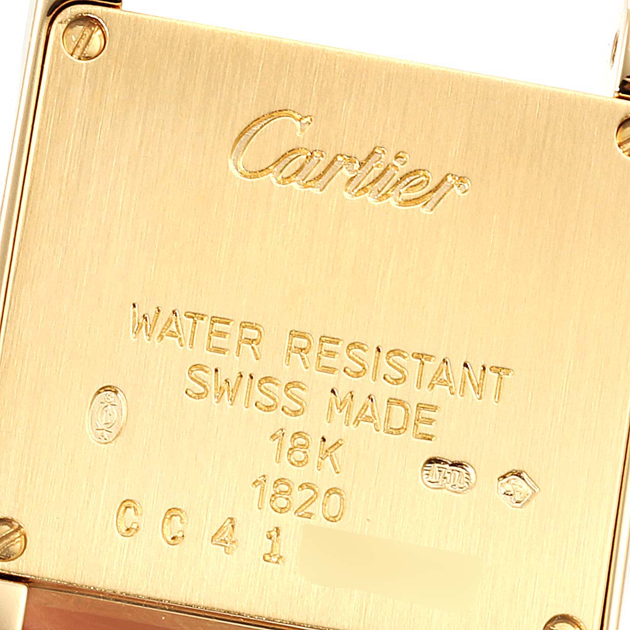 This is the back view of a Cartier Tank Francaise W5000256 Women's Yellow Gold Silver Dial W5000256 Women's Yellow Gold Silver Dial watch, showing markings indicating water resistance, 18K gold, and Swiss manufacture.
