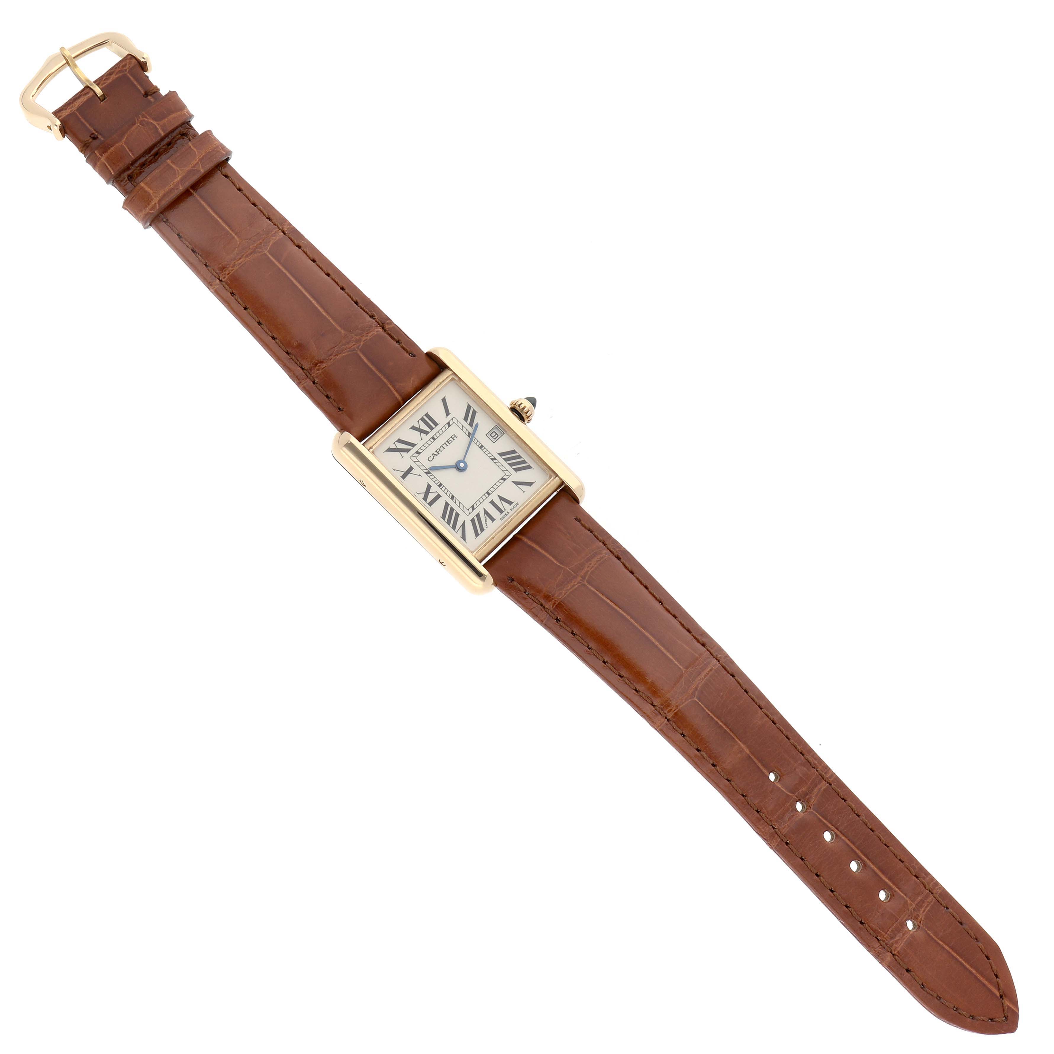 The Tank Louis watch by Cartier is shown from a top-down angle, displaying its rectangular face, brown leather strap, and buckle.