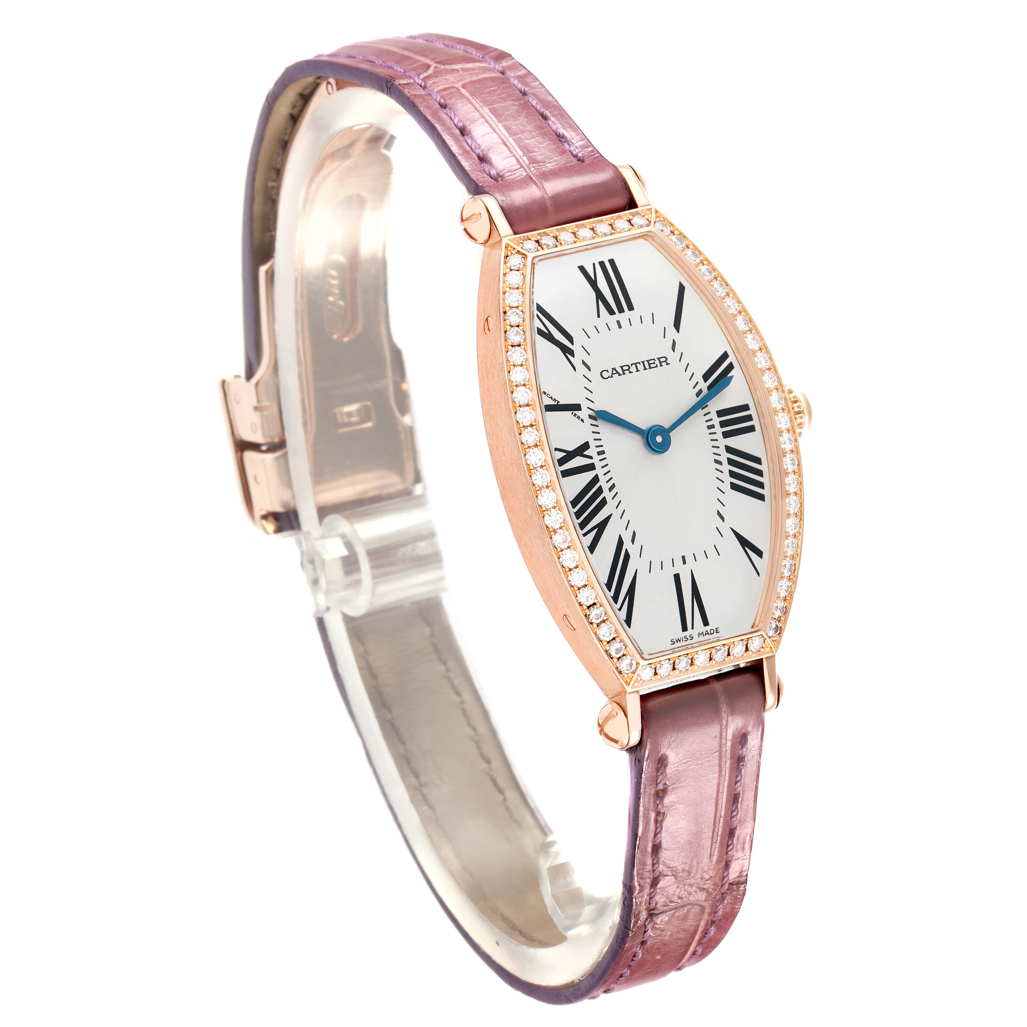 The Cartier Tonneau WE400331 Women's Rose Gold Silver Dial watch is shown at a three-quarter angle, displaying the dial, strap, and diamond-studded bezel.