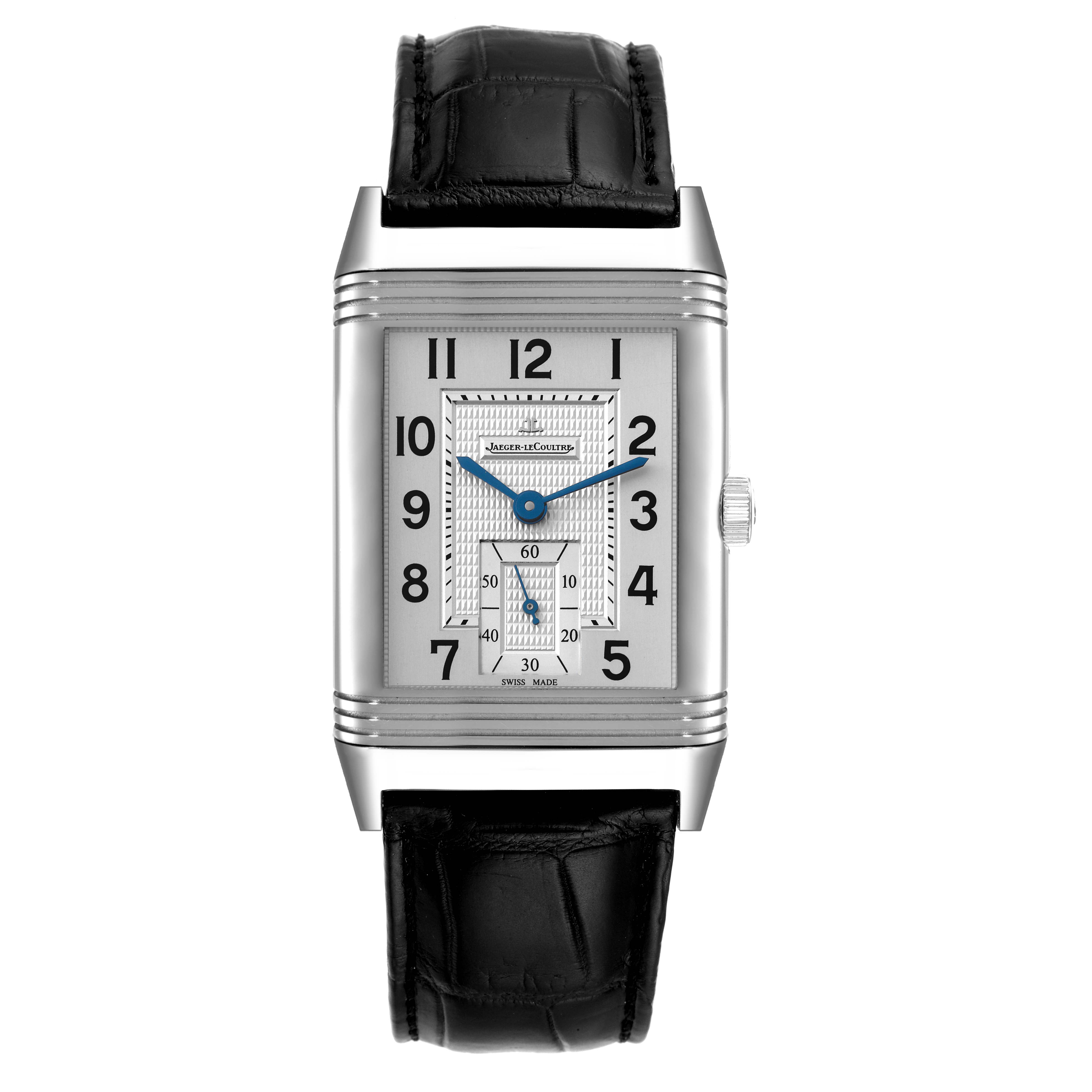 The Jaeger-LeCoultre Reverso watch is shown from a front angle, displaying the dial, case, crown, and black leather strap.