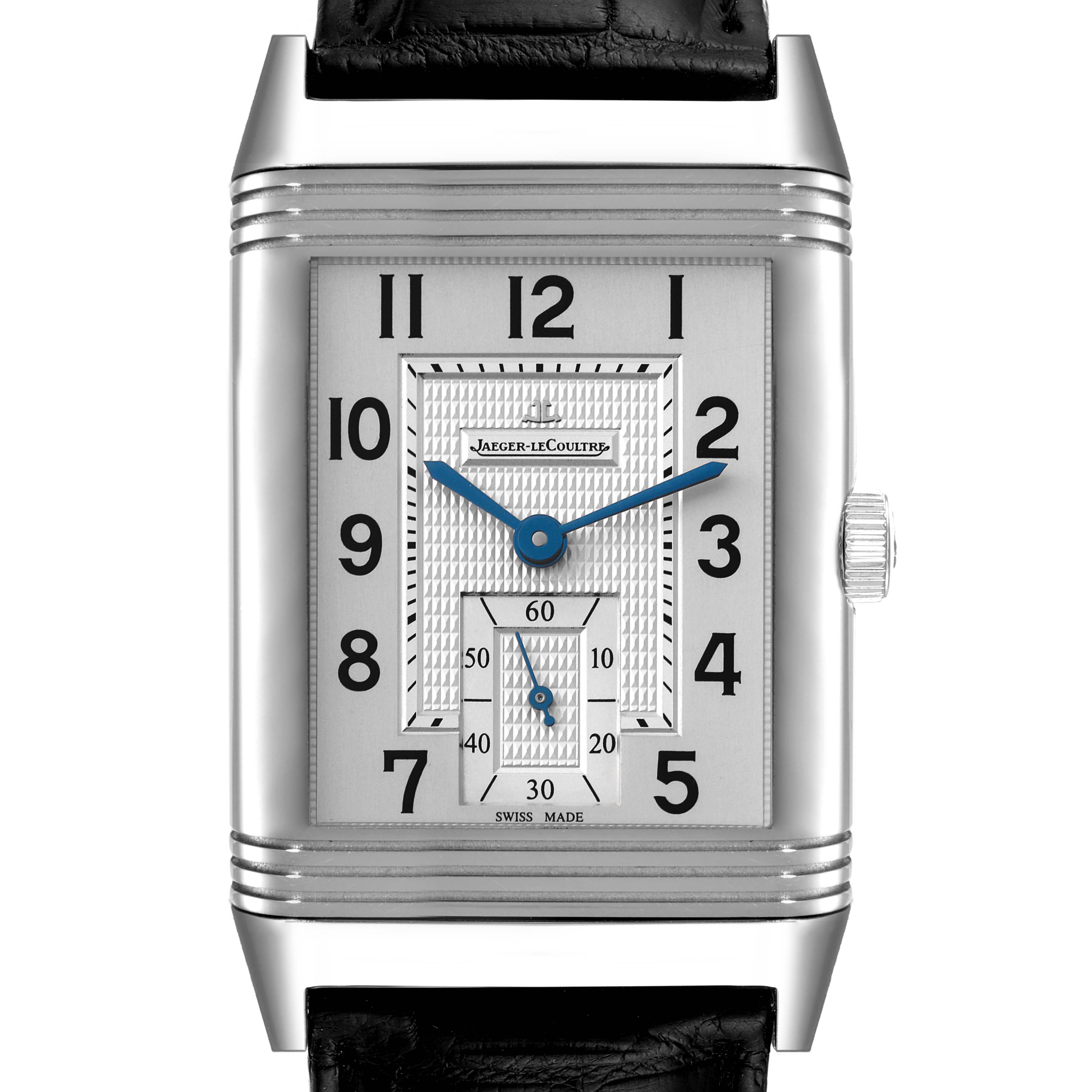 The image shows a Jaeger-LeCoultre Reverso watch from a front view, detailing its rectangular face, blue hands, and black leather strap.