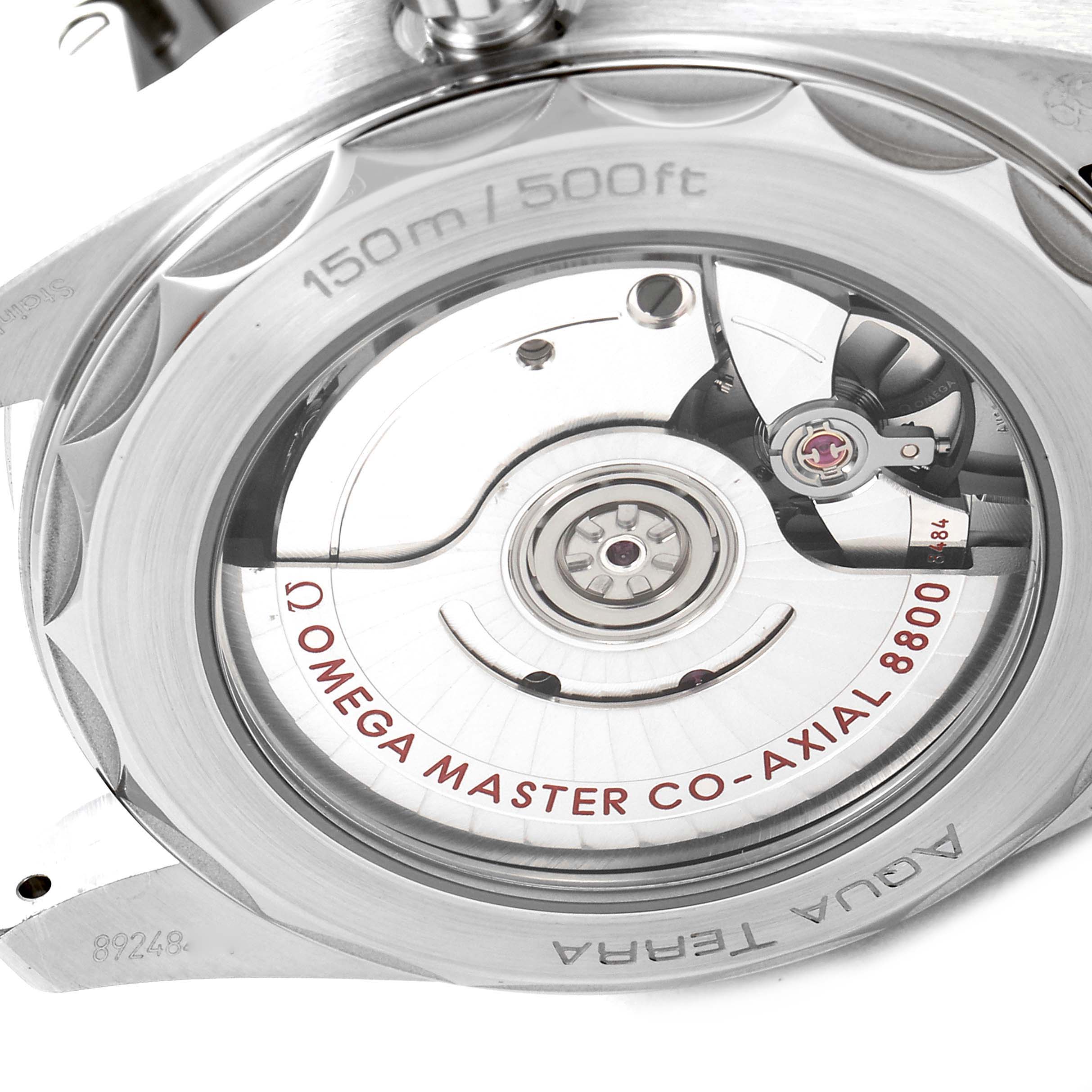 The image shows the back of the Omega Aqua Terra 220.10.38.20.03.001 Men's Stainless Steel Blue Dial 220.10.38.20.03.001 Men's Stainless Steel Blue Dial watch, highlighting the Master Co-Axial 8800 movement through a transparent case back.