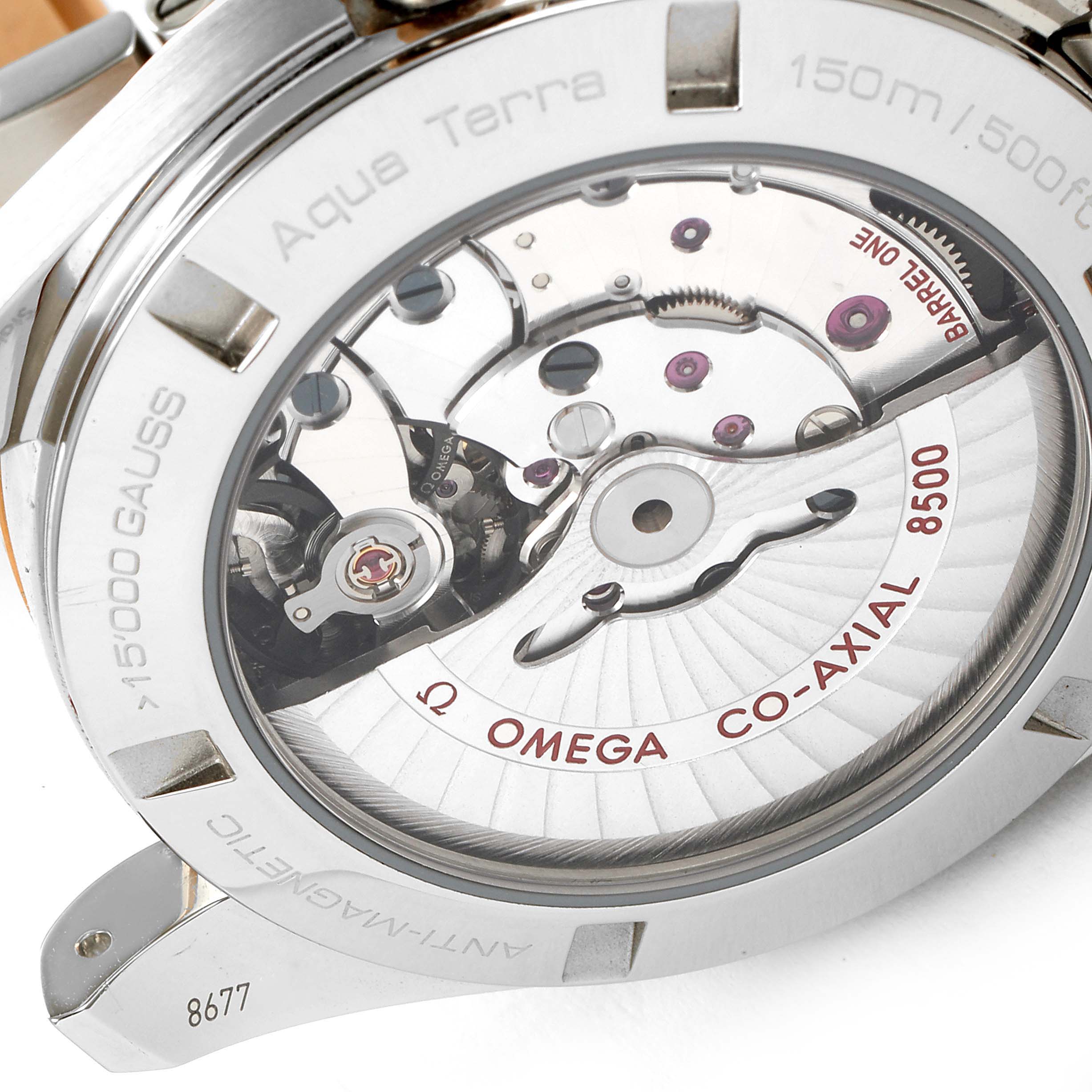 The image shows the back view of the Omega Aqua Terra 231.20.42.21.02.001 Men
s Steel and Gold (two tone) Silver Dial 231.20.42.21.02.001 Men
s Steel and Gold (two tone) Silver Dial watch, highlighting the internal Co-Axial 8500 movement.