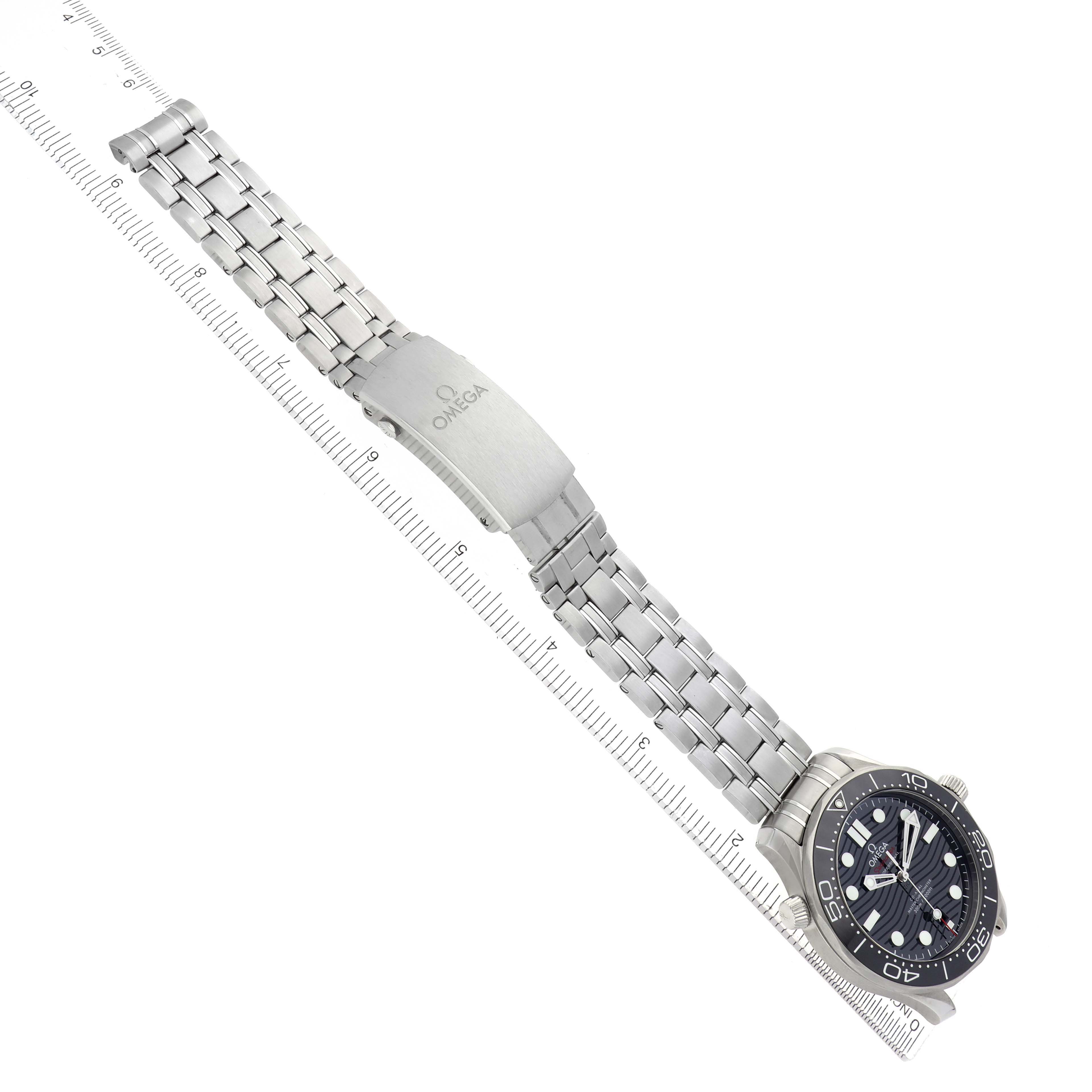 The Omega Seamaster 210.30.42.20.01.001 Men
s Stainless Steel Black Dial watch is shown at an oblique angle, featuring the dial, bezel, bracelet, and clasp.