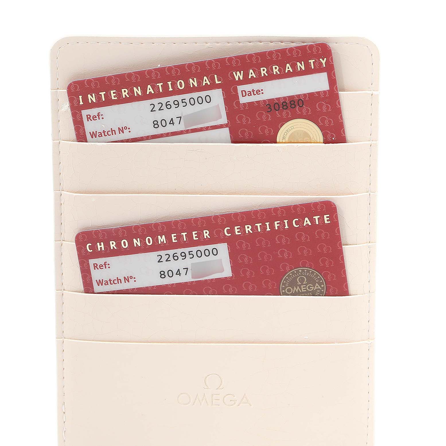 The image shows warranty and chronometer certificate cards for an Omega Seamaster 2269.50.00 Men's Titanium Black Dial 2269.50.00 Men's Titanium Black Dial watch, placed in a white cardholder.