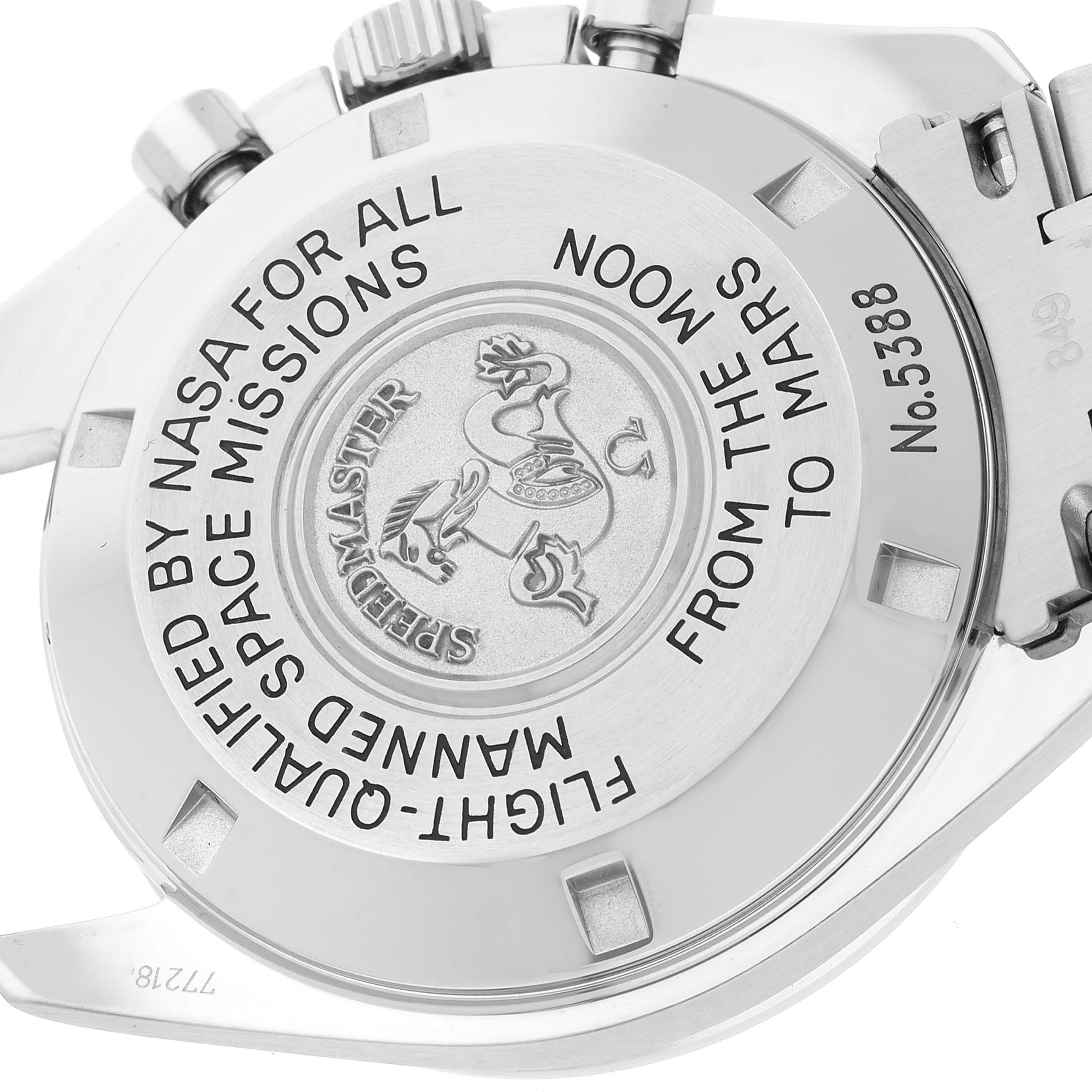 The image shows the back case of the Omega Speedmaster 3577.50.00 Men's Stainless Steel Black Dial 3577.50.00 Men's Stainless Steel Black Dial watch, displaying its engravings and markings.