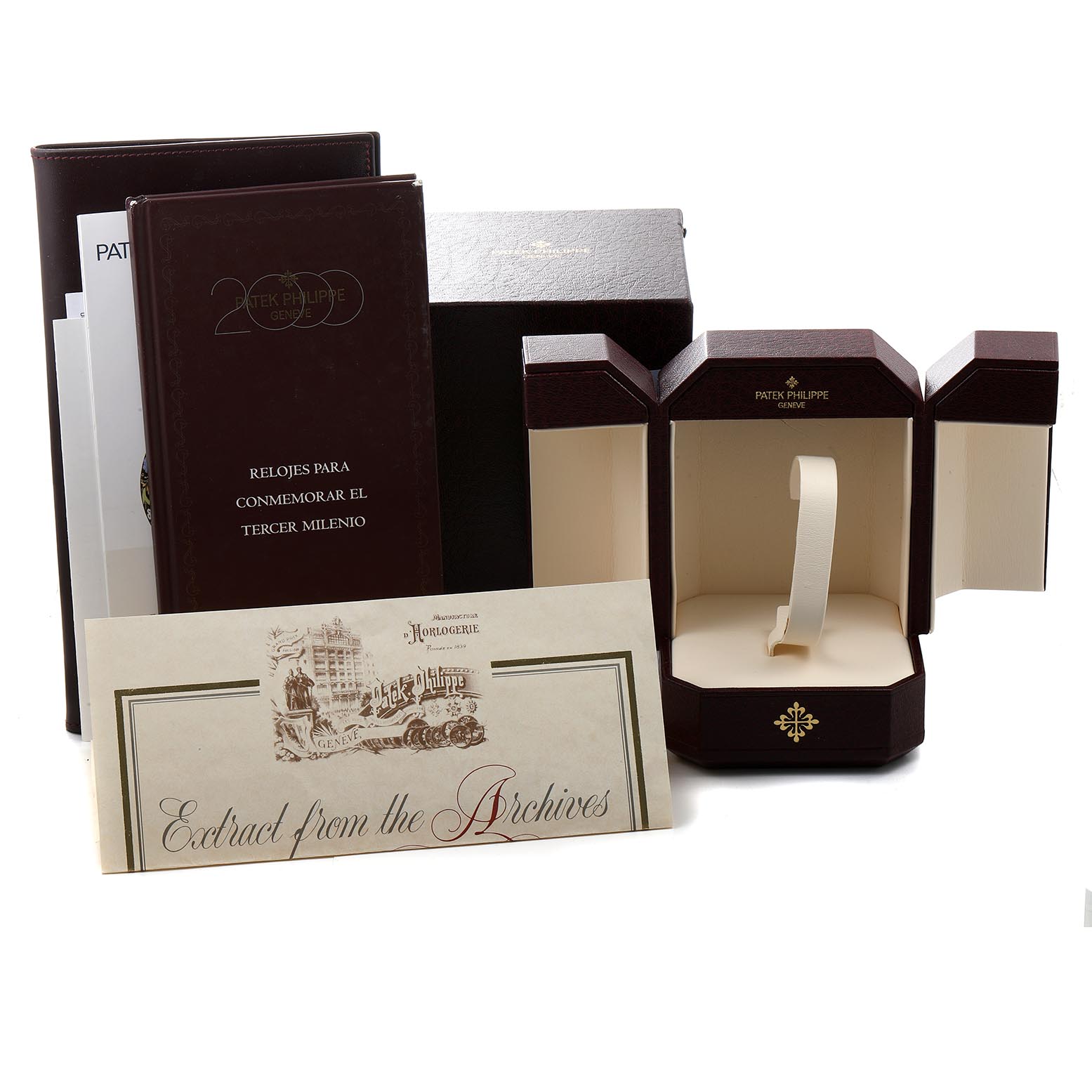 The image shows packaging, booklets, and an open box for the Patek Philippe Gondolo 5100J Men's Yellow Gold Silver Dial 5100J Men's Yellow Gold Silver Dial model watch.